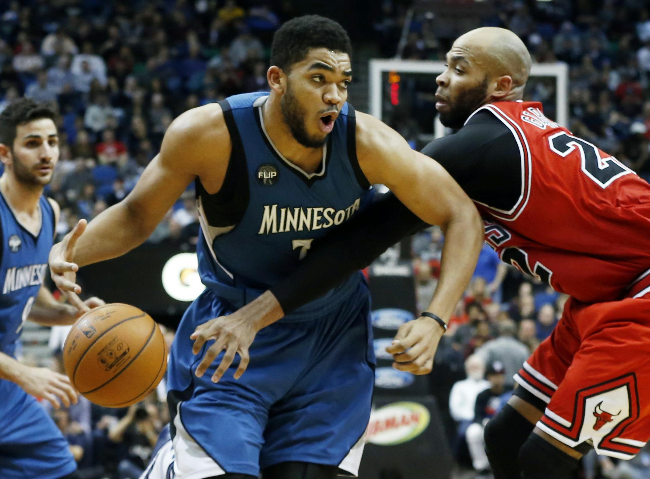 Timberwolves center Karl-Anthony Towns, left