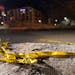 Police tape was crumpled on the ground on 29th Street near S. Colfax Avenue in Minneapolis.