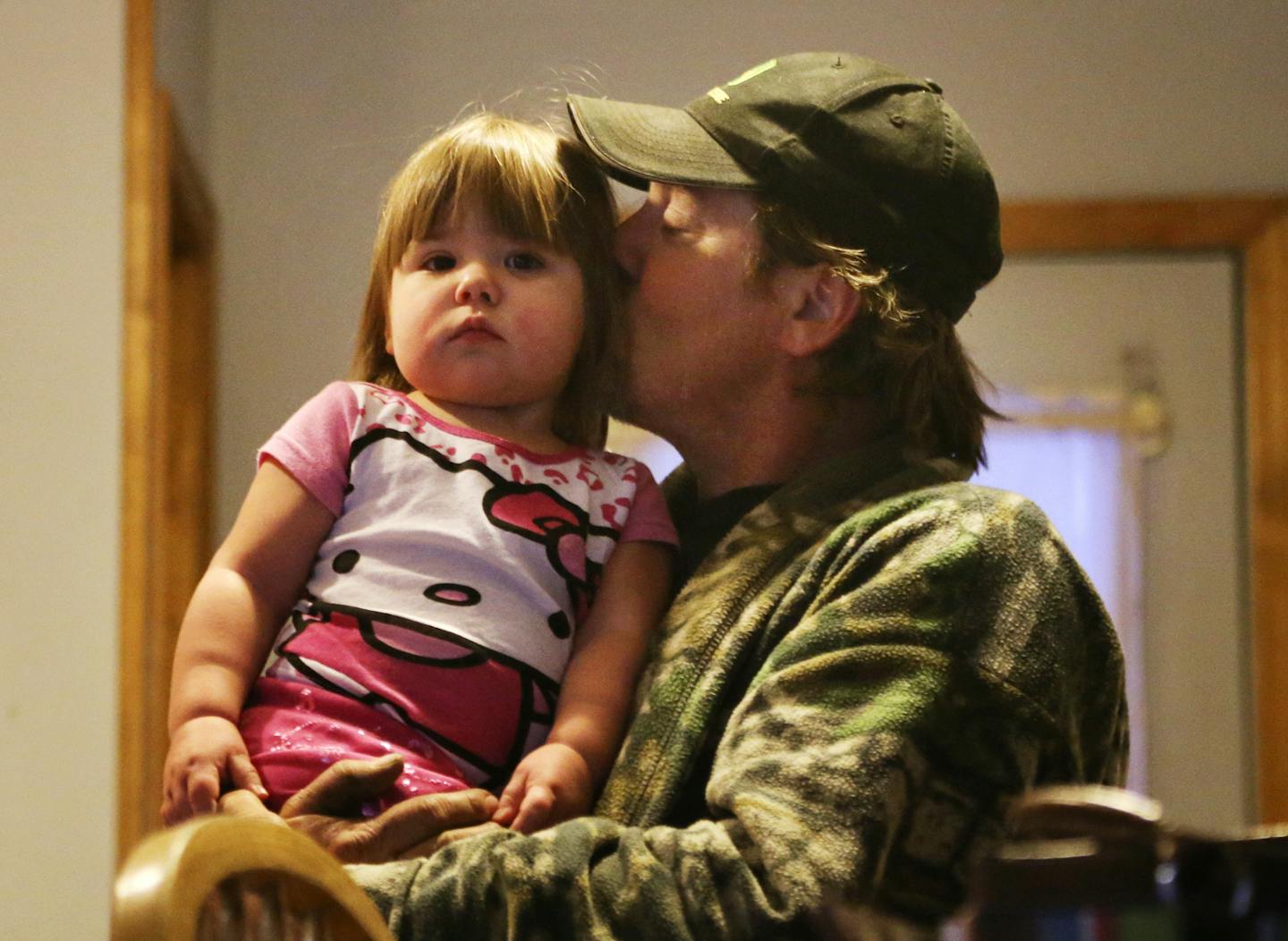 Brian Loch, 43, kisses his daughter Lily during their morning routine Thursday, Feb. 27, 2014, in Menahga, MN. That routine includes a bowl of cheerios and sometimes an episode of Sesame Street -- the only TV Lily watches during the day. A big challenge for Loch is figuring out daycare and affording the payments.](DAVID JOLES/STARTRIBUNE) djoles@startribune.com Single fathers in the U.S. are increasingly shouldering a similar burden. They&#x201a;&#xc4;&#xf4;re raising two million American and 91