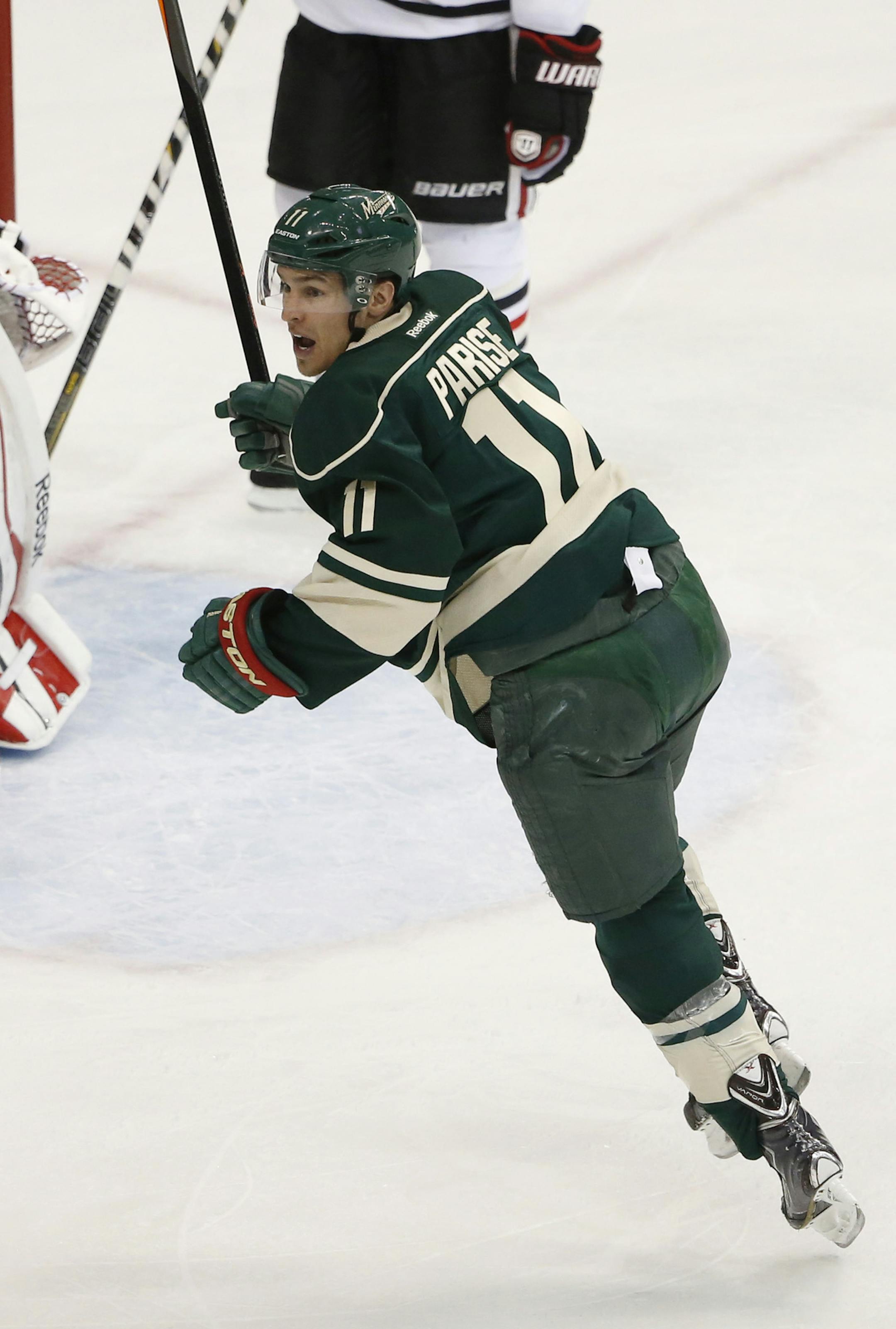 Minnesota Wild left wing Zach Parise (11) celebrated after teammate Minnesota Wild right wing Jason Pominville (29) scored during the second period. ] CARLOS GONZALEZ cgonzalez@startribune.com - May 9, 2014, St. Paul, Minn., Xcel Energy Center, NHL, Minnesota Wild vs. Chicago Blackhawks, Stanley Cup Playoffs Round 2, Game 4