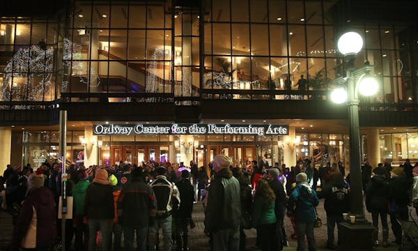 Hundreds of people lined the street in front of the Ordway Center, as the St. Paul Winter Carnivalâ€™s Torchlight Parade passed by. ] JIM GEHRZ �