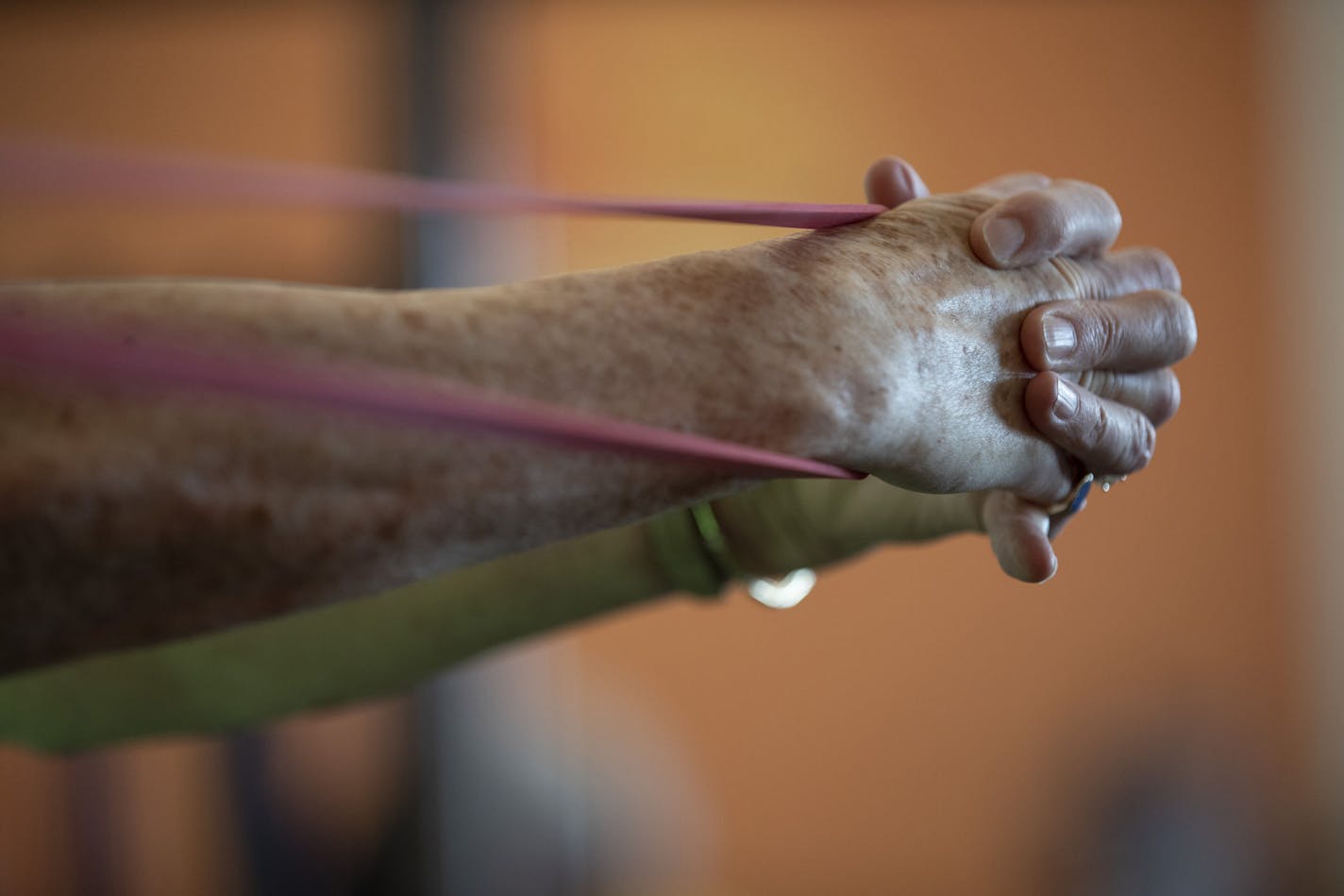 Mary Johnson did resistance training with rubber bands at the Dan Abraham healthy living center Thursday April 4, 2019 in Rochester, MN.] Chad Fritsche Mayo Clinic employee well-being trainer lead a 12-week training session, that focuses on balance, strength, cardiovascular, and stretching Jerry Holt &#x2022; Jerry.holt@startribune.com