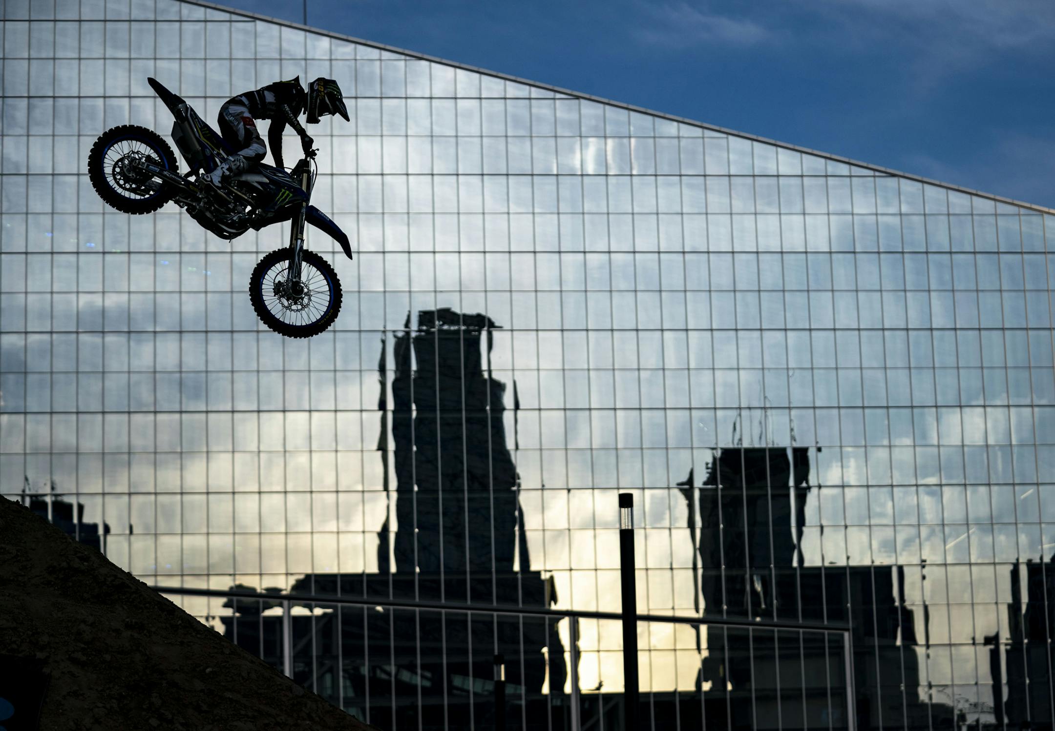 Jarryd McNeil clears the pipe during the Moto X Step Up event in front of U.S. Bank Stadium in Minneapolis, MN.] ALEX KORMANN • alex.kormann@startribune.com The first day of X Games competition kicked off Thursday August 1, 2019 at U.S. Bank stadium with many of the big air events.