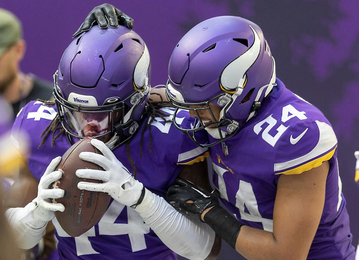 Vikings safety Josh Metellus (44) kisses the ball as he and Vikings safety Camryn Bynum (24) celebrate his interception in the fourth quarter as the Minnesota Vikings take on the Detroit Lions at US Bank Stadium in Minneapolis, Minn., on Sunday, Sept. 25, 2022. ] Elizabeth Flores • liz.flores@startribune.com