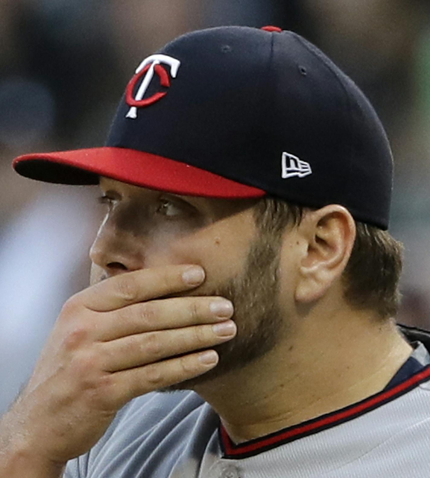 Minnesota Twins staring pitcher Lance Lynn wipes his face during the first inning of the team's baseball game against the Chicago White Sox, Saturday, May 5, 2018, in Chicago. (AP Photo/Nam Y. Huh)