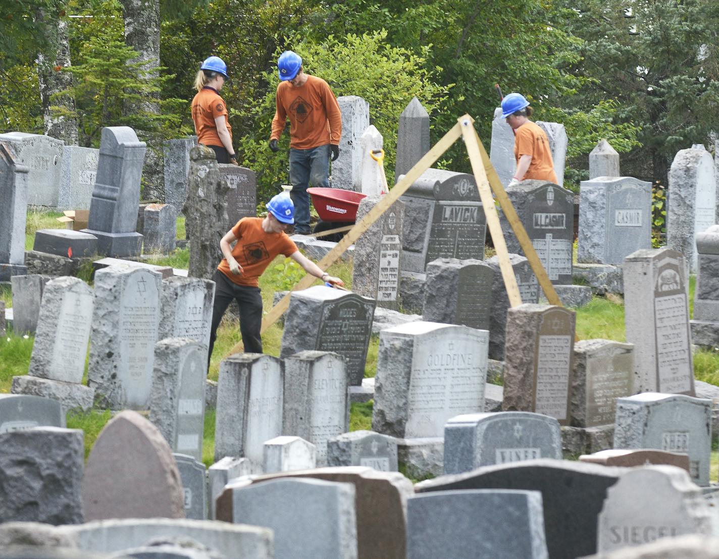 Northern Bedrock teaches young adults the proper techniques for preserving aging gravestones. Above, a group worked at Adas Israel Cemetery in Duluth.