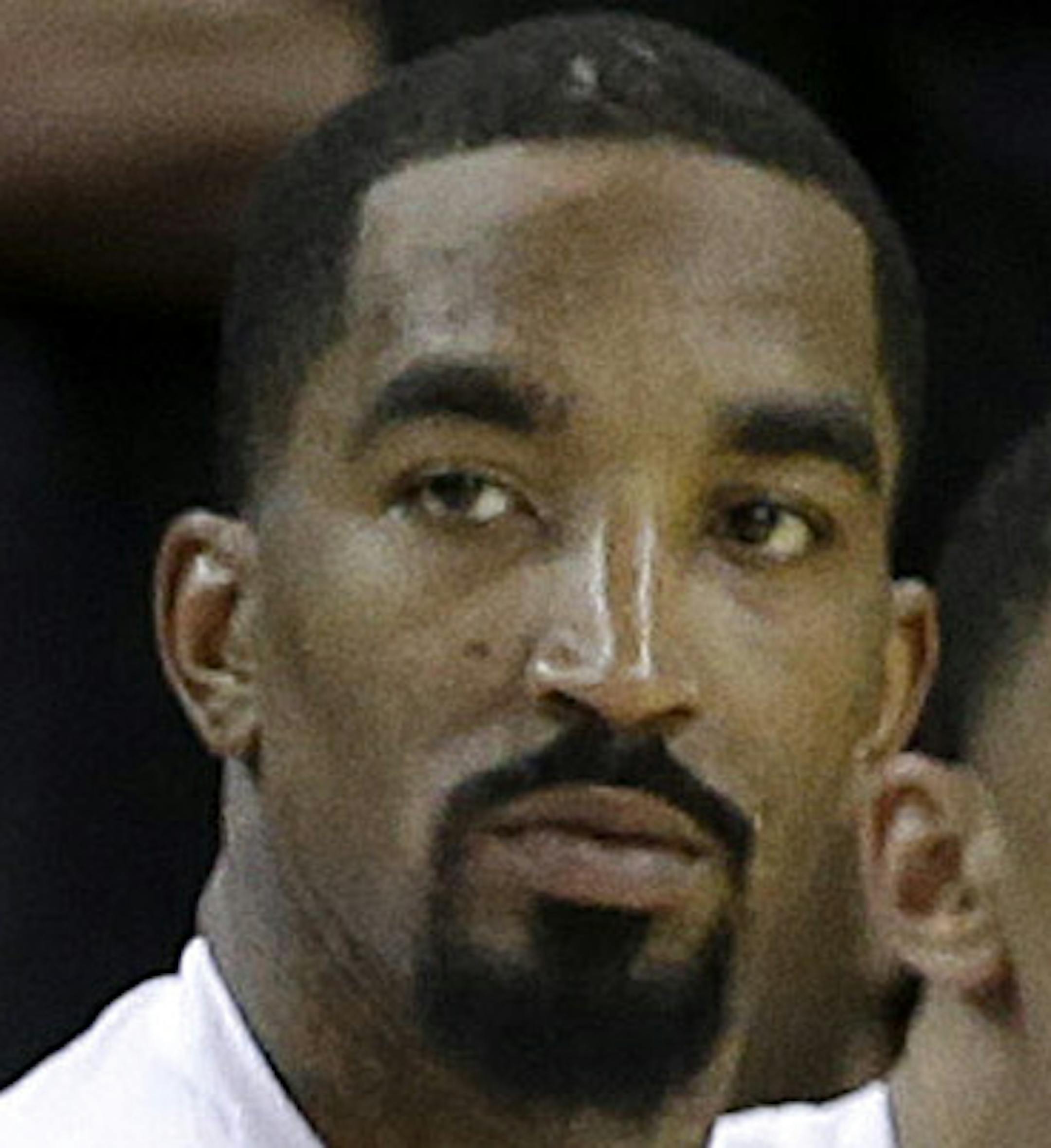 Cleveland Cavaliers' Kyrie Irving, from second from left, LeBron James, J.R. Smith and teammates sit on the bench during the second half of Game 2 of basketball's NBA Finals against the Golden State Warriors in Oakland, Calif., Sunday, June 5, 2016. (AP Photo/Marcio Jose Sanchez)