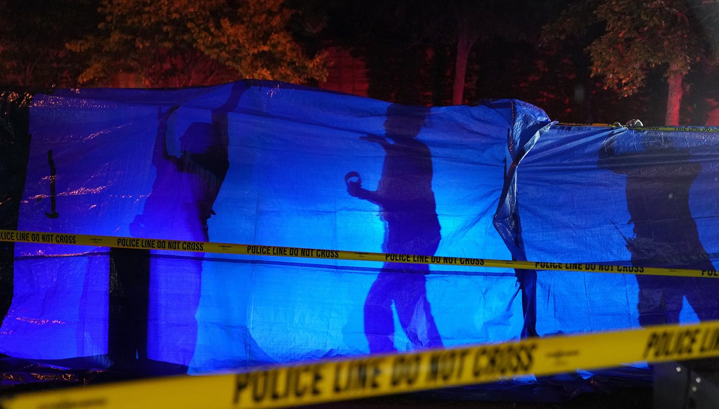 Police erected a blue tarp to block the view of a body at the scene of an officer involved shooting on East 77th Street in Richfield. ] ANTHONY SOUFFLE &#x2022; anthony.souffle@startribune.com Police investigated the scene of an officer involved shooting after Edina police officers shot and killed a knife-wielding man following a brief vehicle pursuit Saturday, Sept. 7, 2019 on East 77th Street in Richfield.