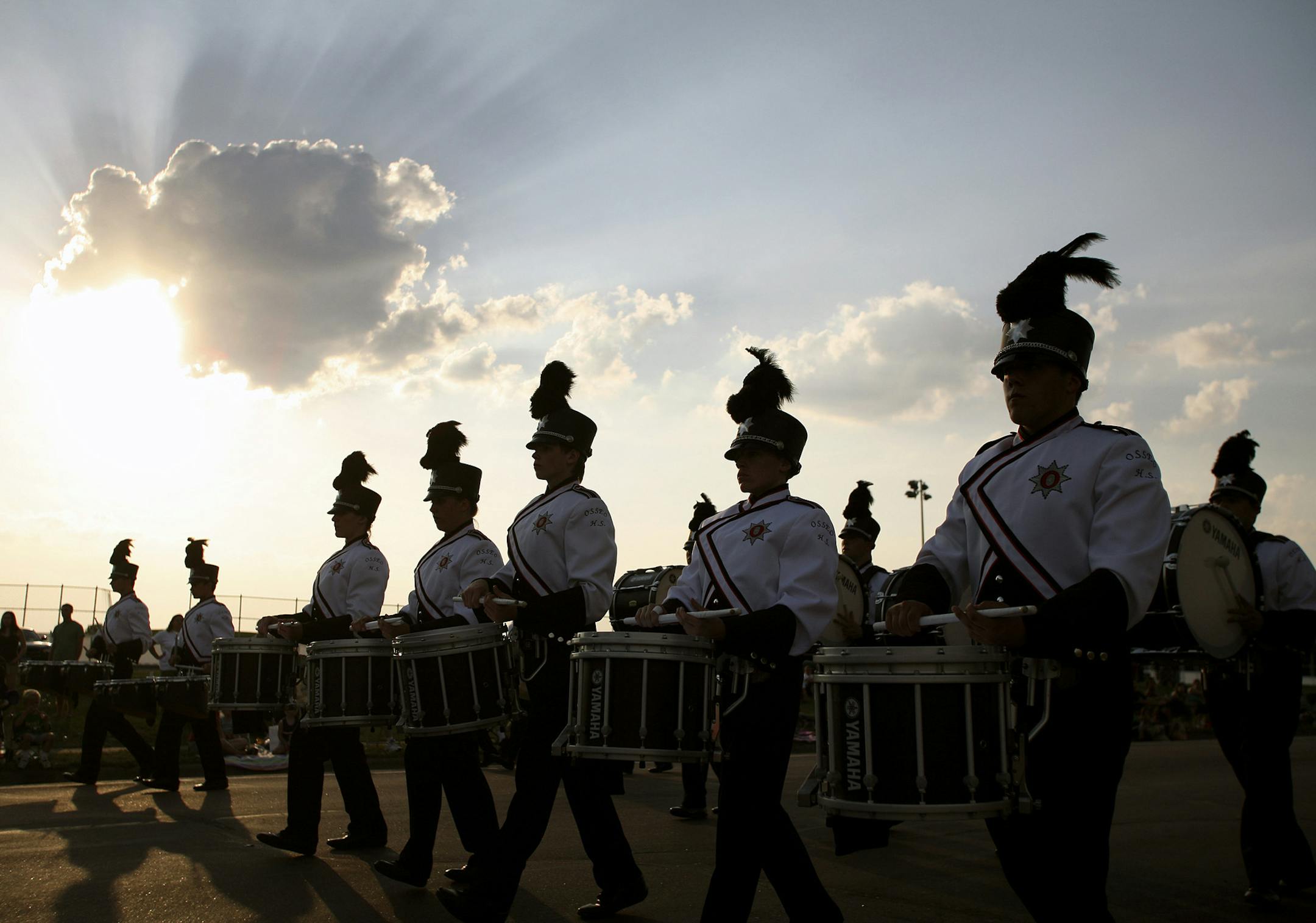 JENNIFER SIMONSON &#xac;&#x2022; jsimonson@startribune.com Brooklyn Park, MN-June 14, 2007 The Osseo High School marching band performed along Noble Avenue during Brooklyn Park's Tater Daze parade. A committee of Osseo band booster parents have organized a marching band festival that will feature more than a dozen high school bands on June 23. GENERAL INFORMATION: The Osseo High School marching band will be preparing to march in the Tater Daze parade later this evening. ORG XMIT: MIN201306071945