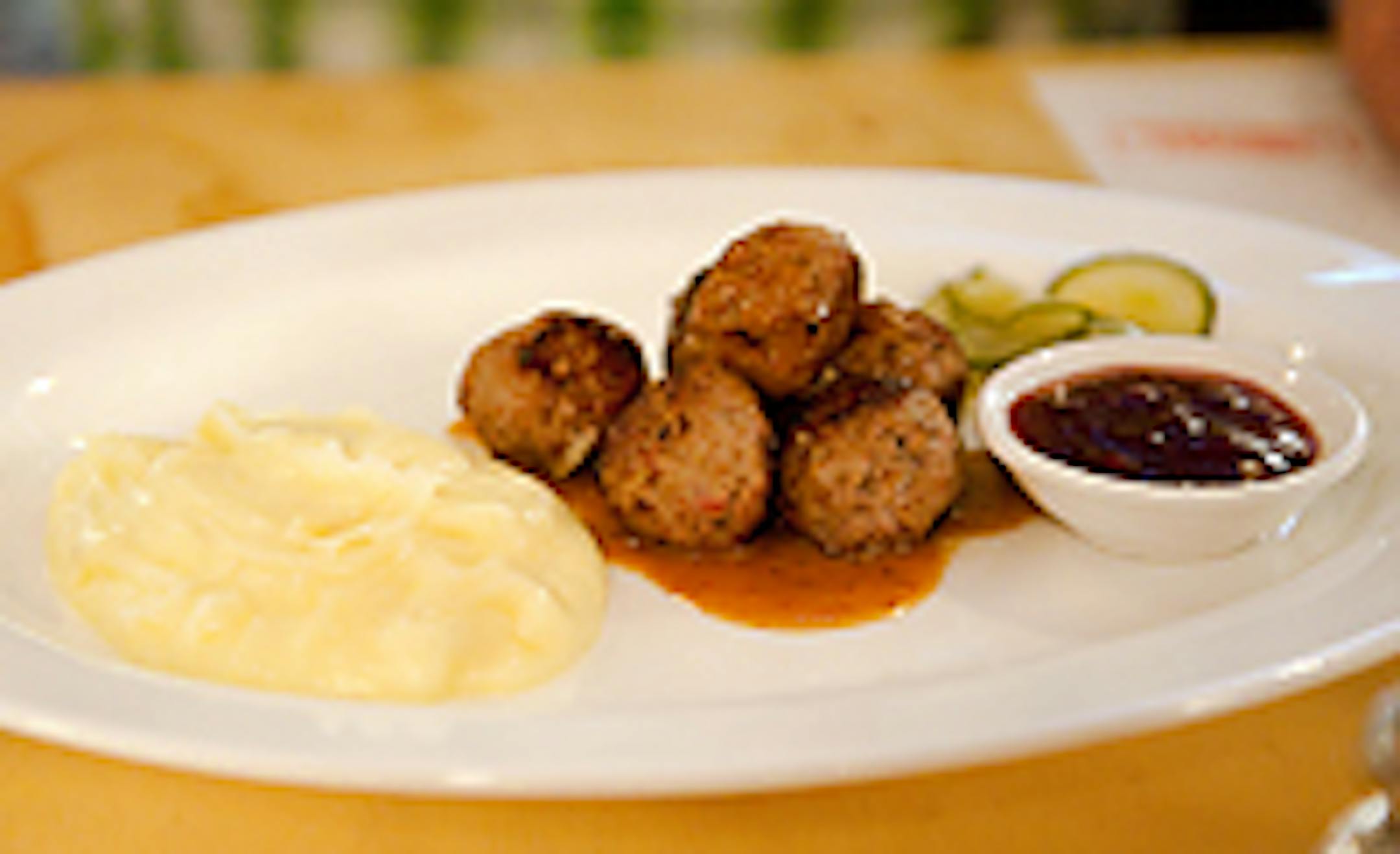 Meatballs with lingonberries, potatoes and pickled cucumbers at the Bachelor Farmer