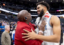 Timberwolves All-Star Karl-Anthony Towns, right, gets a hug from his father after the Wolves eliminated the Nuggets in the second round of the playoff