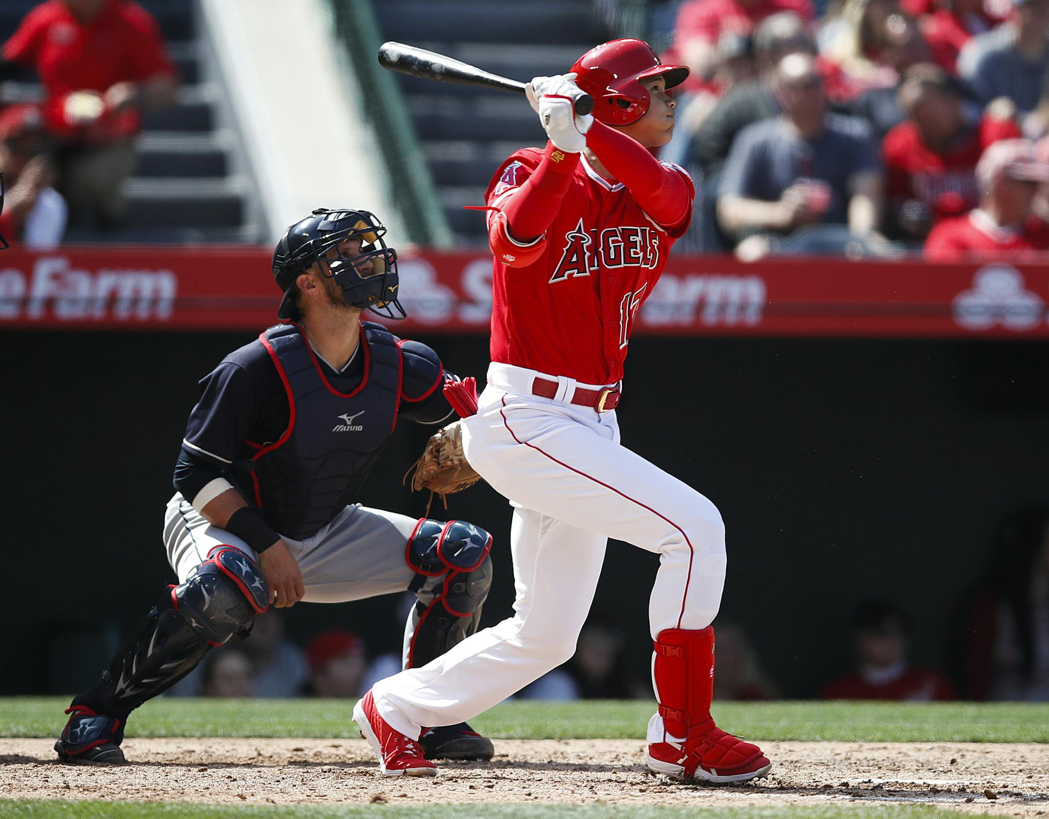 Los Angeles Angels' Shohei Ohtani, of Japan, watches the flight of his two-run home run during the fifth inning of a baseball game against the Cleveland Indians Wednesday, April 4, 2018, in Anaheim, Calif. (AP Photo/Jae C. Hong)