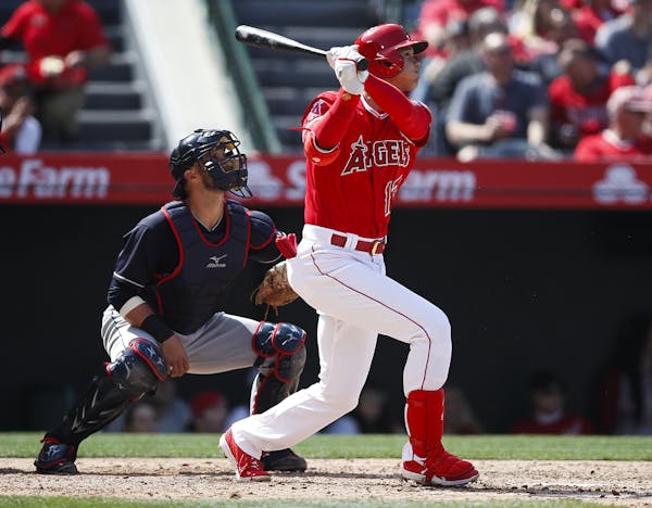 Los Angeles Angels' Shohei Ohtani, of Japan, watches the flight of his two-run home run during the fifth inning of a baseball game against the Clevela