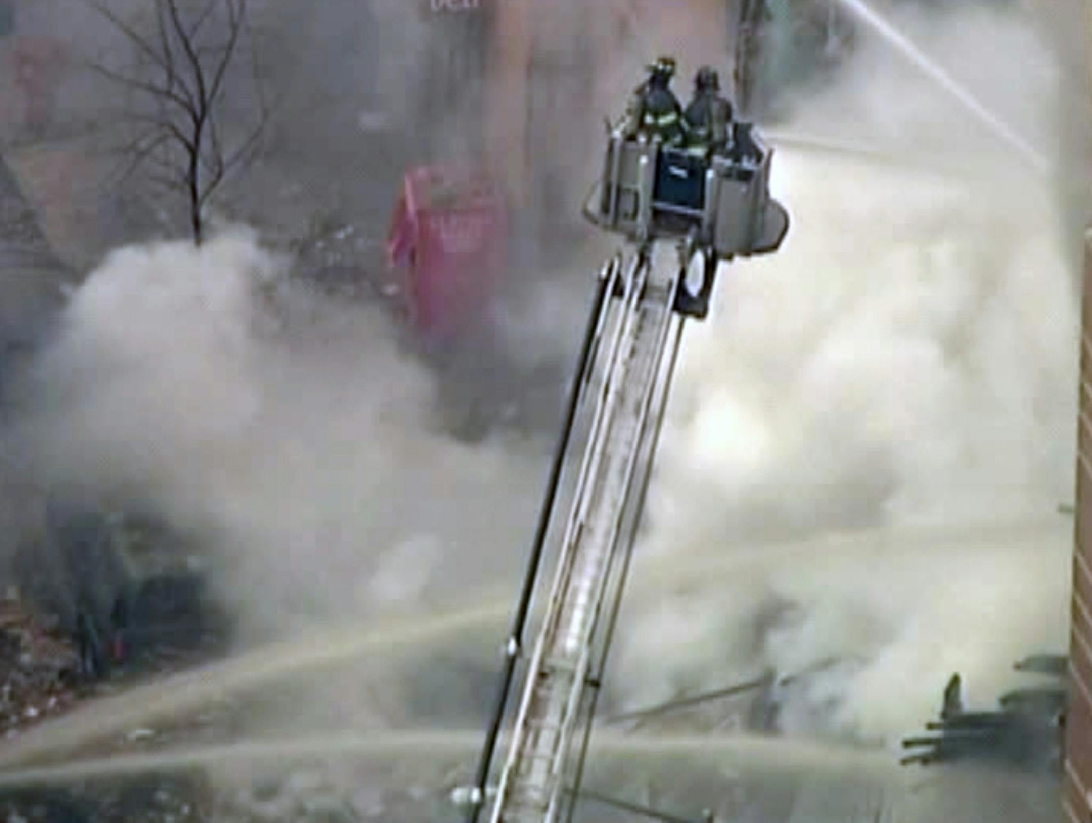 In this image taken from video from WABC, firefighters battle a blaze at the site of a possible explosion and building collapse in the East Harlem neighborhood of New York, Wednesday, March 12, 2014.