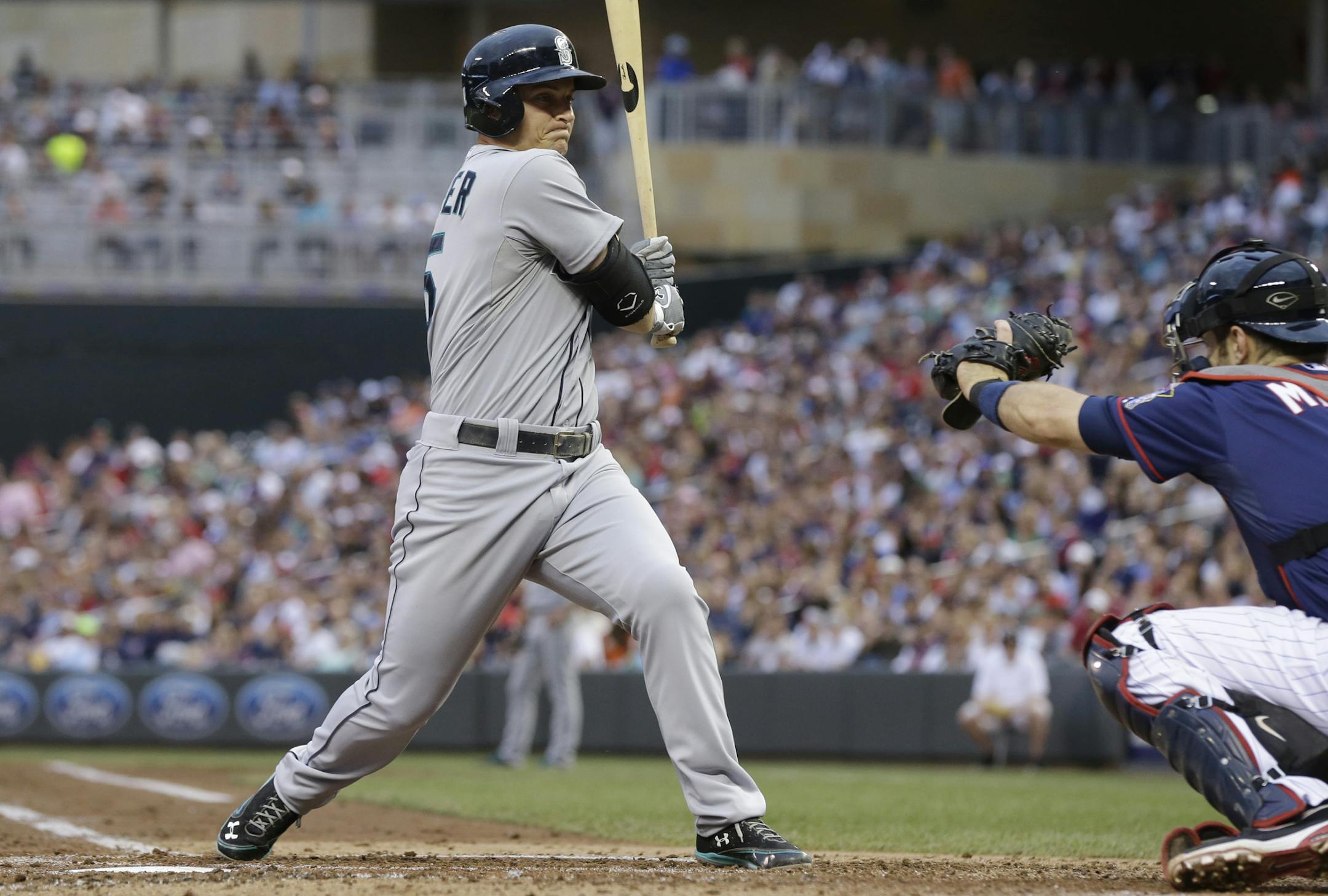 Seattle Mariners' Kyle Seager turns away from a close pitch by Minnesota Twins' Mike Pelfrey in the third inning of a baseball game, Friday, May 31, 2013 in Minneapolis. (AP Photo/Jim Mone)