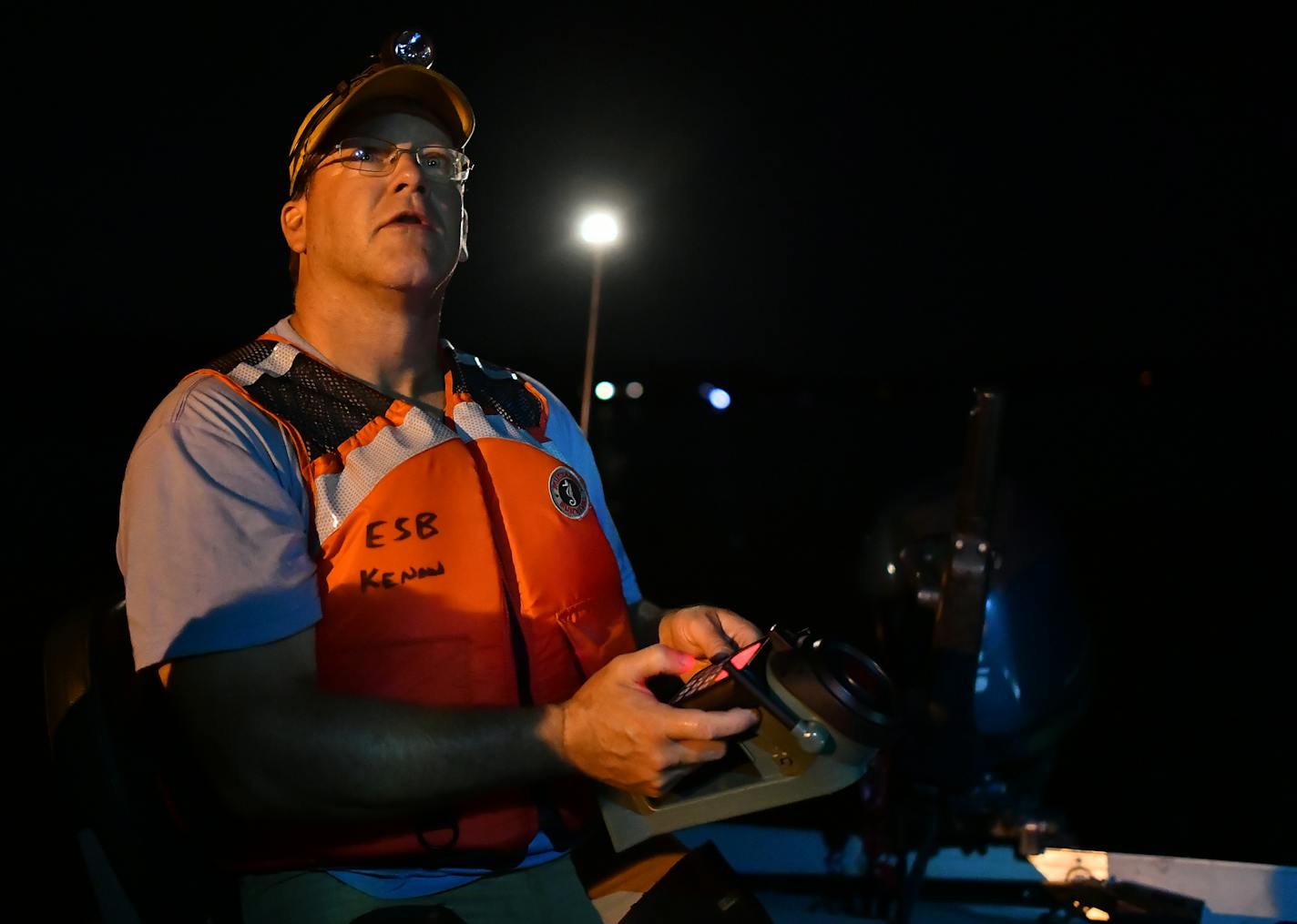 Research assistant Steve Houdek used a game caller to broadcast the sounds of a loon in distress in order to locate nearby loons. ] (AARON LAVINSKY/STAR TRIBUNE) aaron.lavinsky@startribune.com A look at new loon research at a time when Minnesota stands to share in BP Oil Spill settlement money to benefit the state bird. We photograph U.S. Geological Survey wildlife research biologist Kevin Kenow, DNR non-game wildlife program specialist Lori Naumann and research assistant Steve Houdek as they tr