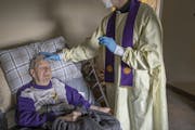The Rev. Andrew Jaspers gave last rites to 85-year-old COVID-19 patient Chuck Schuh on December 5, 2020. Schuh's family gave permission for this photo