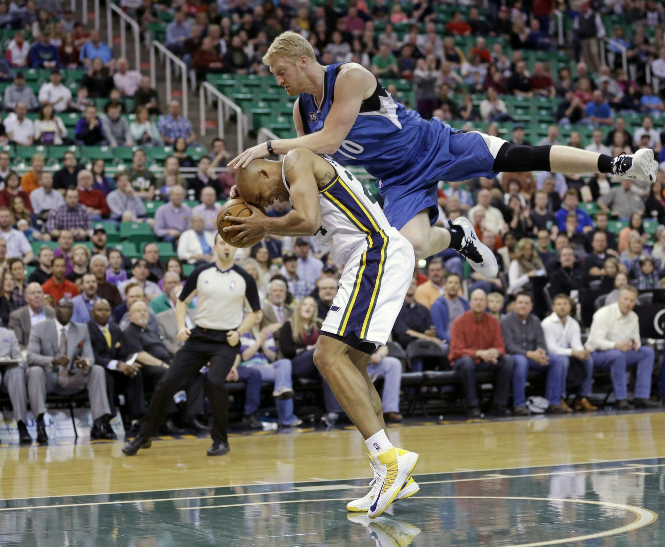 Minnesota Timberwolves' Chase Budinger (10) fouls Utah Jazz's Richard Jefferson (24) in the first quarter of an NBA basketball game, Feb. 22, 2014, in Salt Lake City. (AP Photo/Rick Bowmer)