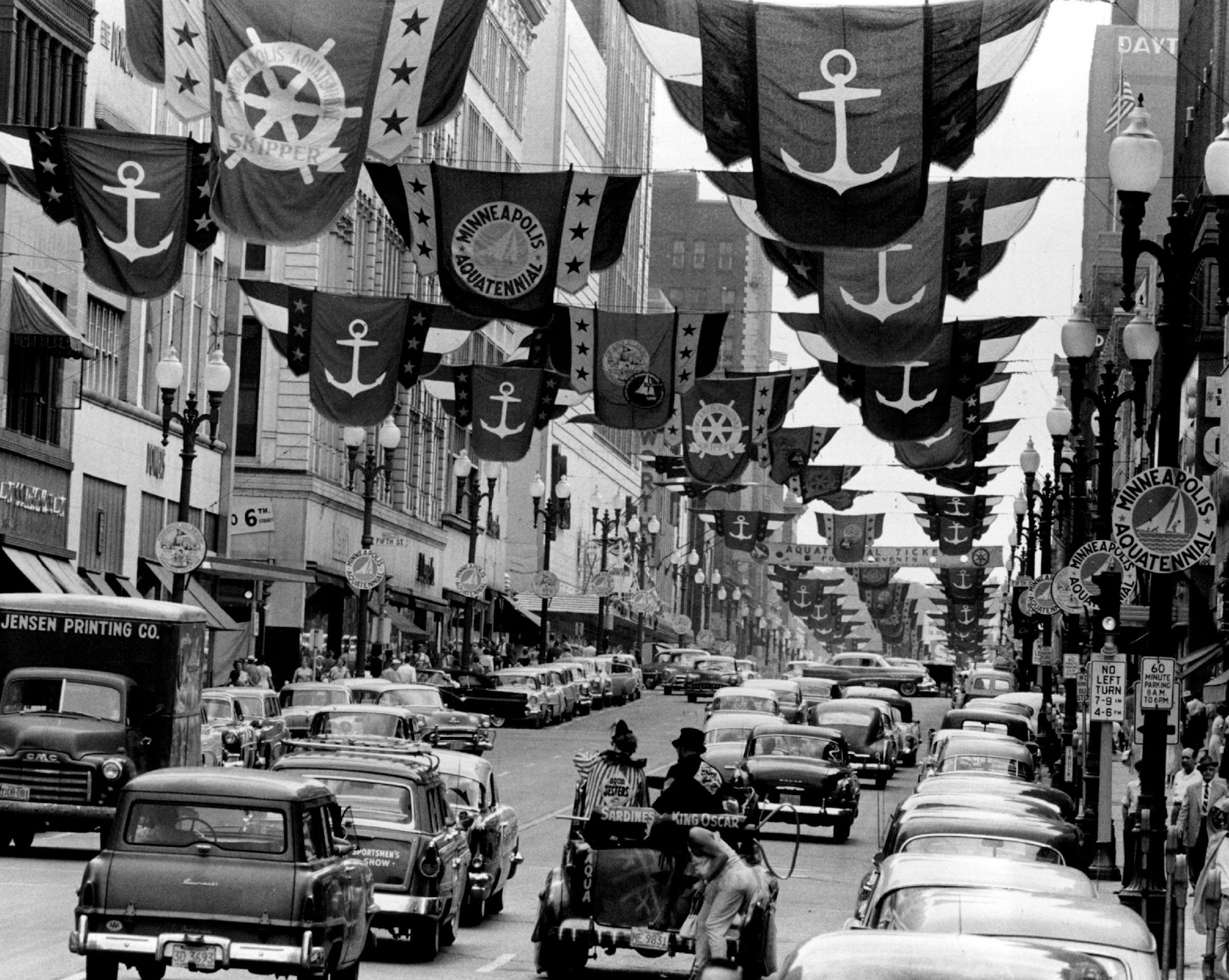 July 19, 1956: AQUATENNIAL DECORATIONS up and down Nicollet avenue gave Minneapolis a holiday appearance. The avenue was all dressed up in fluttering flags and bunting in preparation for formal opening Friday of the big civic celebration, and the daylight parade Saturday.