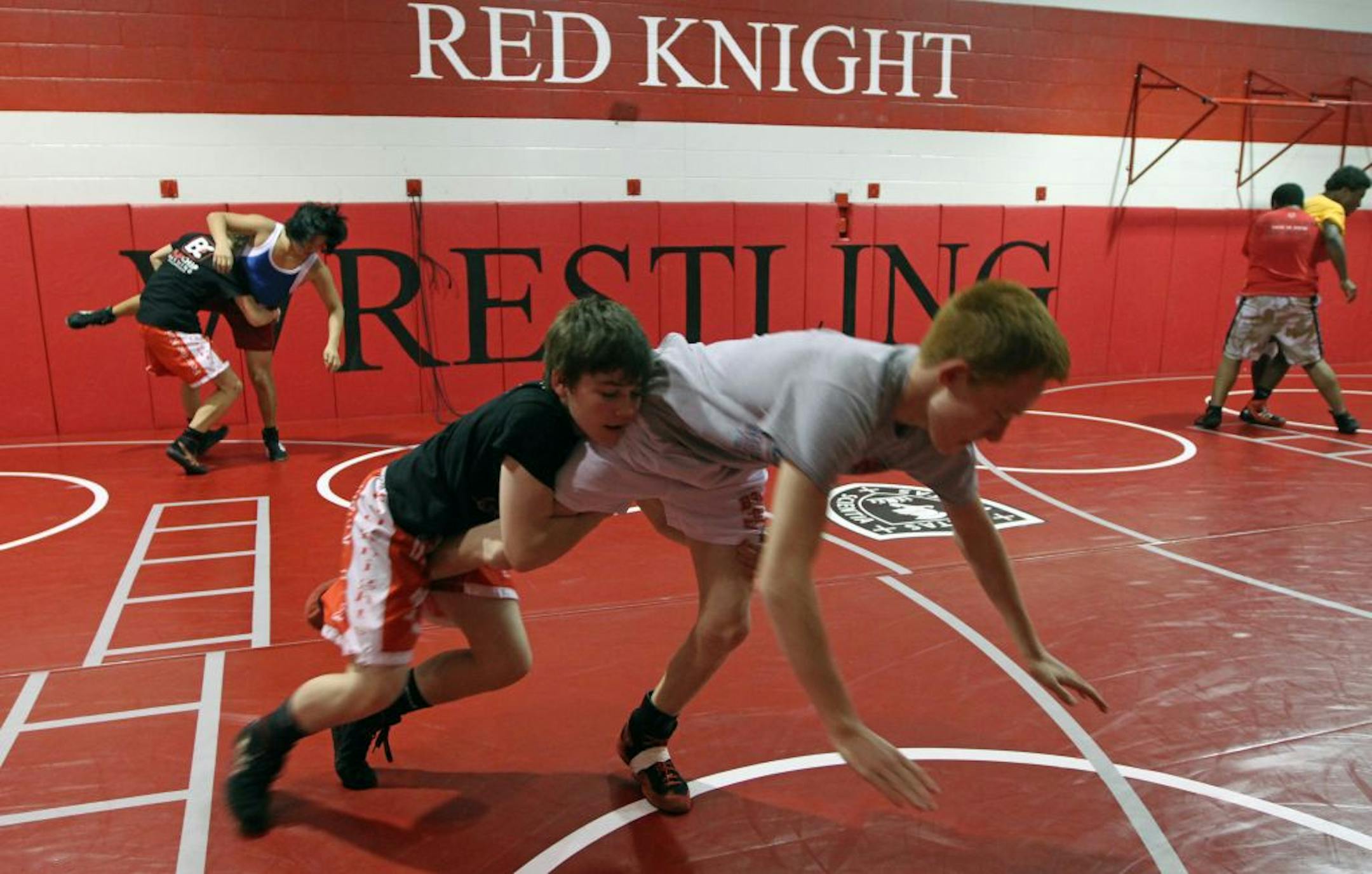 Foreground, from left: Jake Allar and Jarred Oftedahl, at practice at Benilde-St. Margaret's last week, are among the group that coach Larry Allar calls the "Fab Five" — his five wrestlers who are ranked in the top seven in their respective weight classes. Jake Allar, Larry's son, is ranked seventh at 106 pounds; Oftedahl is No. 1 at 113. Photo by Bruce Bisping • bbisping@startribune.com