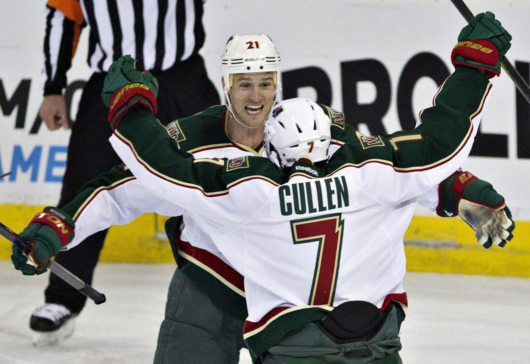 Minnesota Wild's Matt Cullen and Kyle Brodziak celebrate Cullen's second goal on the Edmonton Oilers.