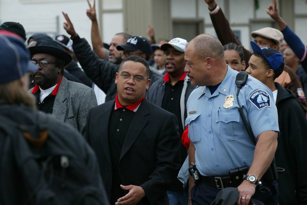 Don Banham Jr. and Minnesota attorney general Keith Ellison, who was a member of the Minnesota Legislature at the time, walk through a north Minneapolis neighborhood during an anti-violence march in 2004.