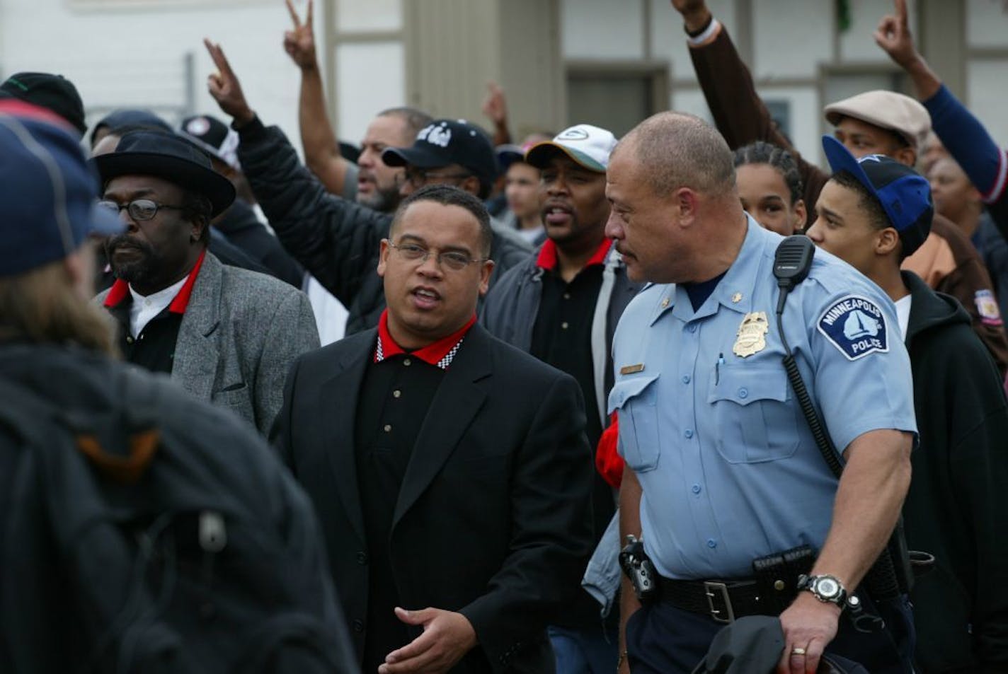 Don Banham Jr. and Minnesota attorney general Keith Ellison, who was a member of the Minnesota Legislature at the time, walk through a north Minneapolis neighborhood during an anti-violence march in 2004.