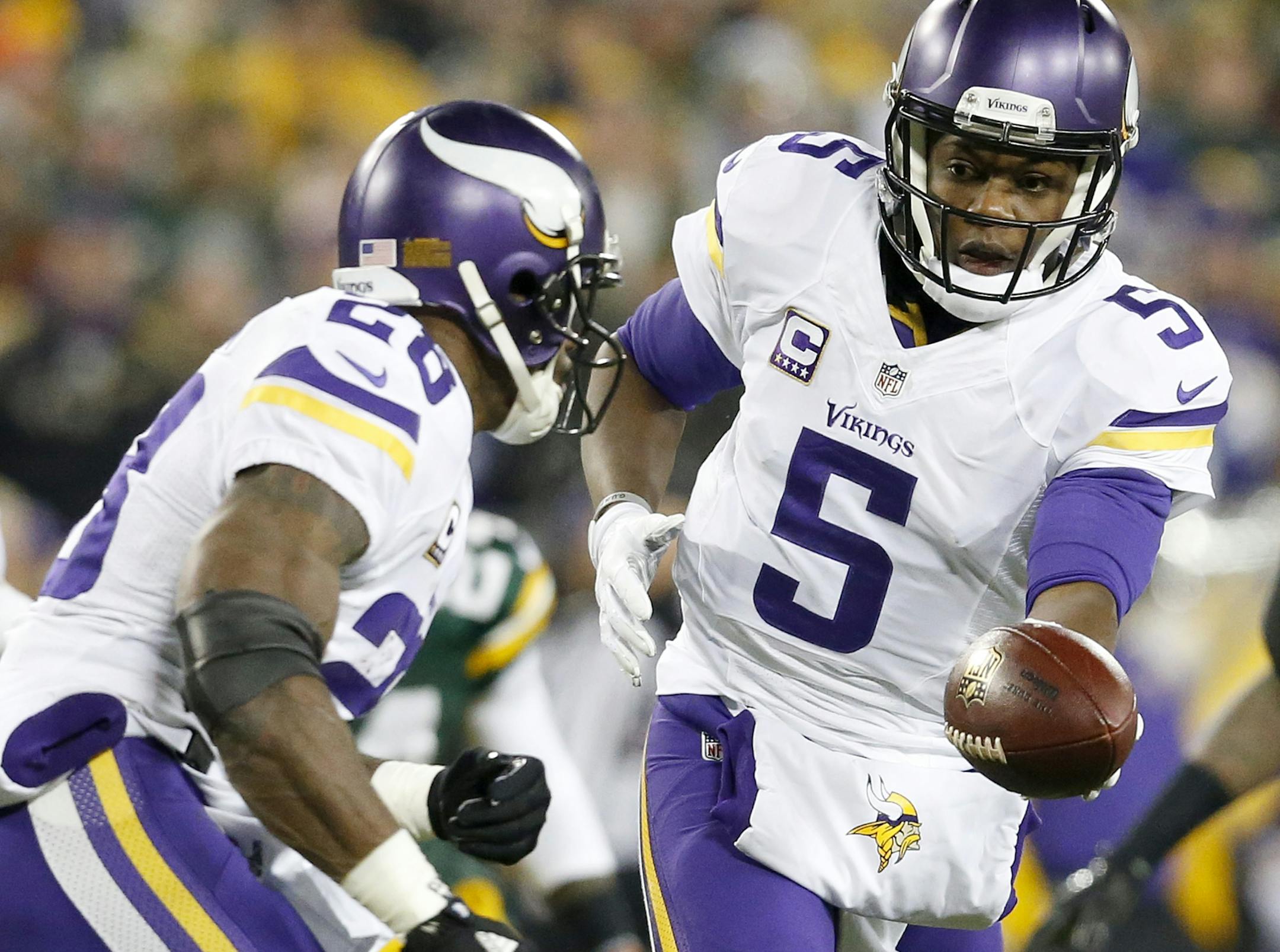 Minnesota Vikings Teddy Bridgewater (5) and Adrian Peterson (28).