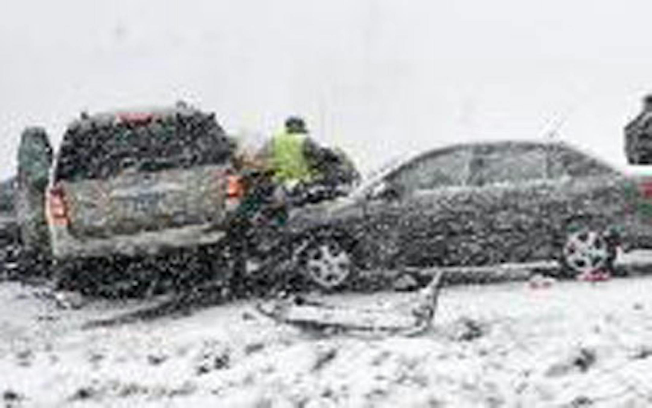 Emergency crews work the scene of a crash that killed four people on Interstate 94 west of Alexandria, Minn., on Monday.