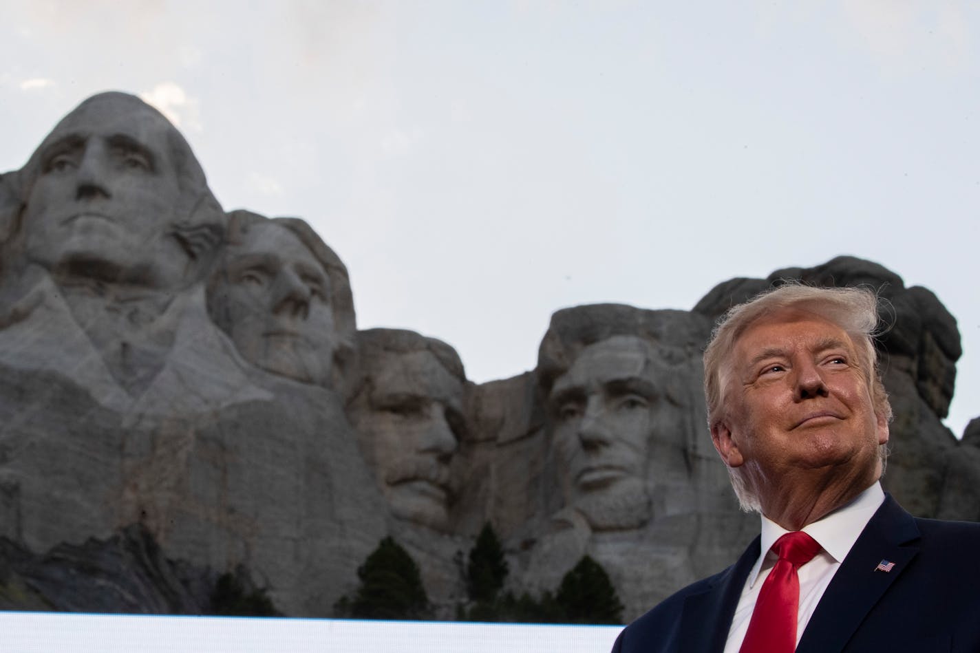 FILE - In this July 3, 2020, file photo, President Donald Trump stands at Mount Rushmore National Memorial, near Keystone, S.D. South Dakota Gov. Kristi Noem says she gave former president Donald Trump a $1,100 bust depicting the president on Mount Rushmore last year because she knew it was something he wanted to receive. The gift was presented to Trump when he visited South Dakota on Friday, July 3, 2020 for an Independence Day fireworks celebration.