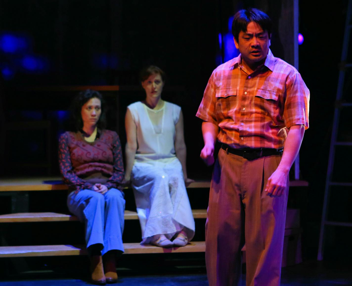 "The Paper Dreams of Harry Chin" - MN History Theatre
(l-r) Meghan Kriedler, Sandra Struthers and Song Kim (foreground) as Harry Chin. Photo credit: Scott Pakudaitis