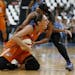 Phoenix Mercury's guard Diana Taurasi calls out to the ref while fighting for possession of the ball against Minnesota Lynx's guard Jia Perkins during