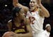 Maryland center Brionna Jones, right, pressures Minnesota forward Taiye Bello in the first half of an NCAA college basketball game, Sunday, Feb. 26, 2