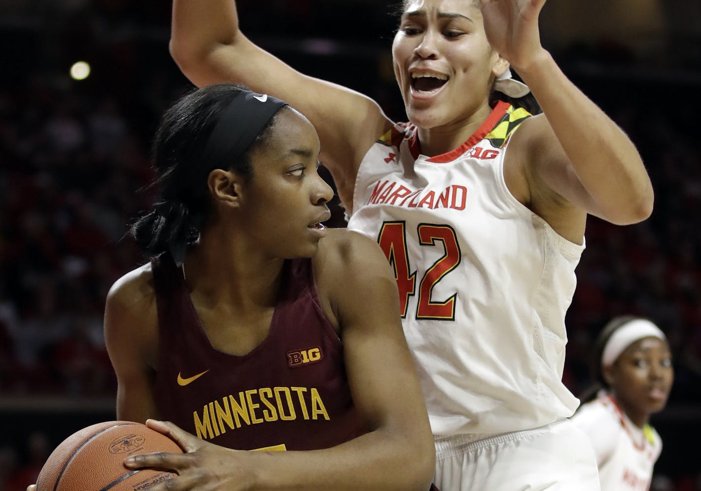 Maryland center Brionna Jones, right, pressures Minnesota forward Taiye Bello in the first half of an NCAA college basketball game, Sunday, Feb. 26, 2017, in College Park, Md. (AP Photo/Patrick Semansky) ORG XMIT: MIN2017030120181646