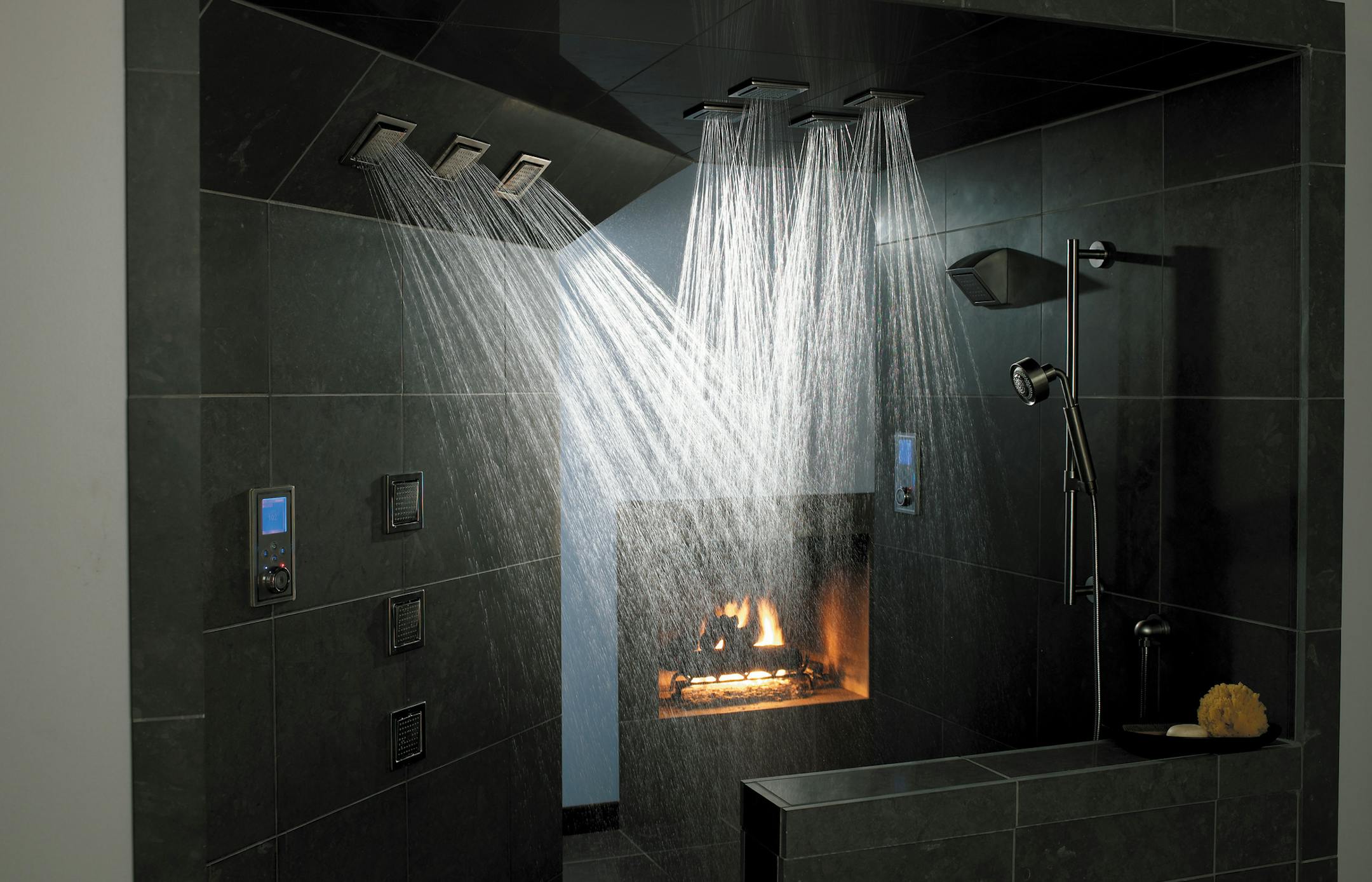 Showers are getting bigger and more elaborate, sometimes at the expense of bathtubs. This shower features Kohler's WaterTile 54-Nozzle Bodyspray and a DTV digital platform that wraps water, sound, light and steam together in a customizable system. credit: Kohler K-684-2CPK-8002-BN, polished chrome; brushed nickel