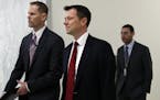 Peter Strzok, center, the FBI agent facing criticism following a series of anti-Trump text messages, arrives to appear before the House Judiciary Comm