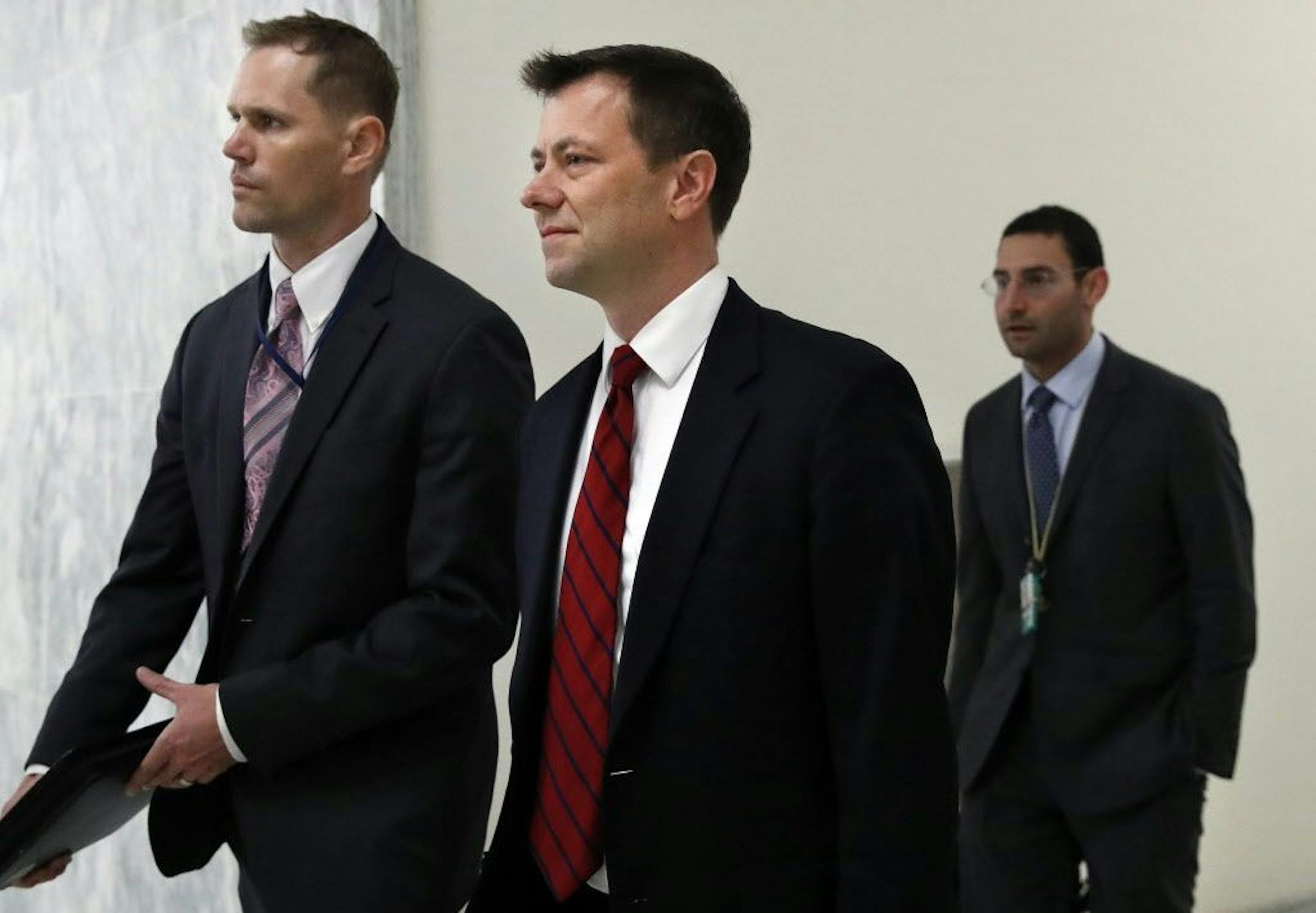 Peter Strzok, center, the FBI agent facing criticism following a series of anti-Trump text messages, arrives to appear before the House Judiciary Committee, Wednesday, June 27, 2018, on Capitol Hill in Washington.