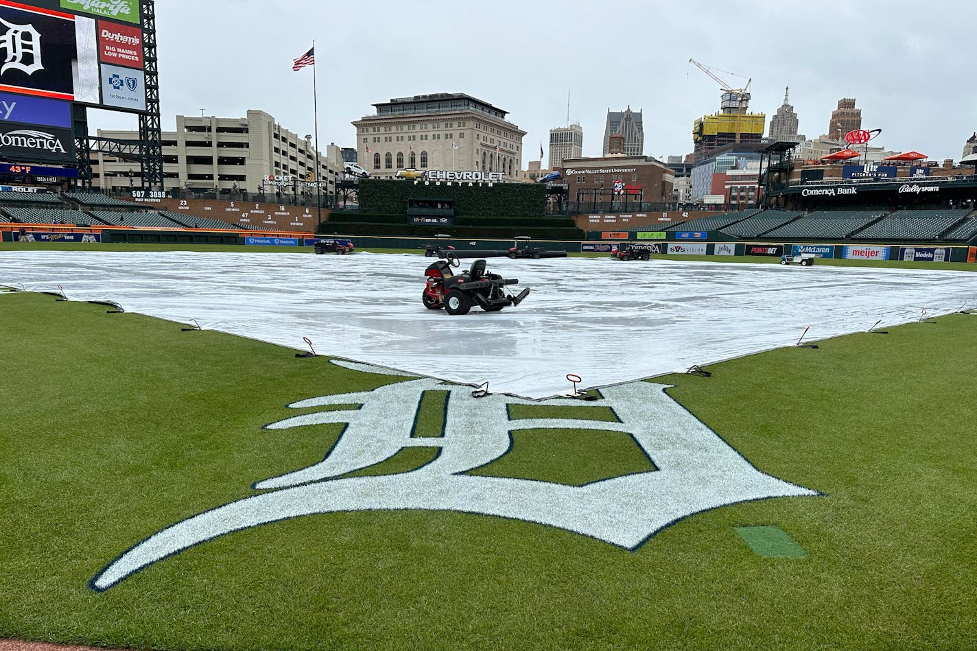 A tarp covers the Comerica Park field before a baseball game between the Detroit Tigers and the New York Mets, Tuesday, May 2, 2023, in Detroit. (AP Photo/\\)