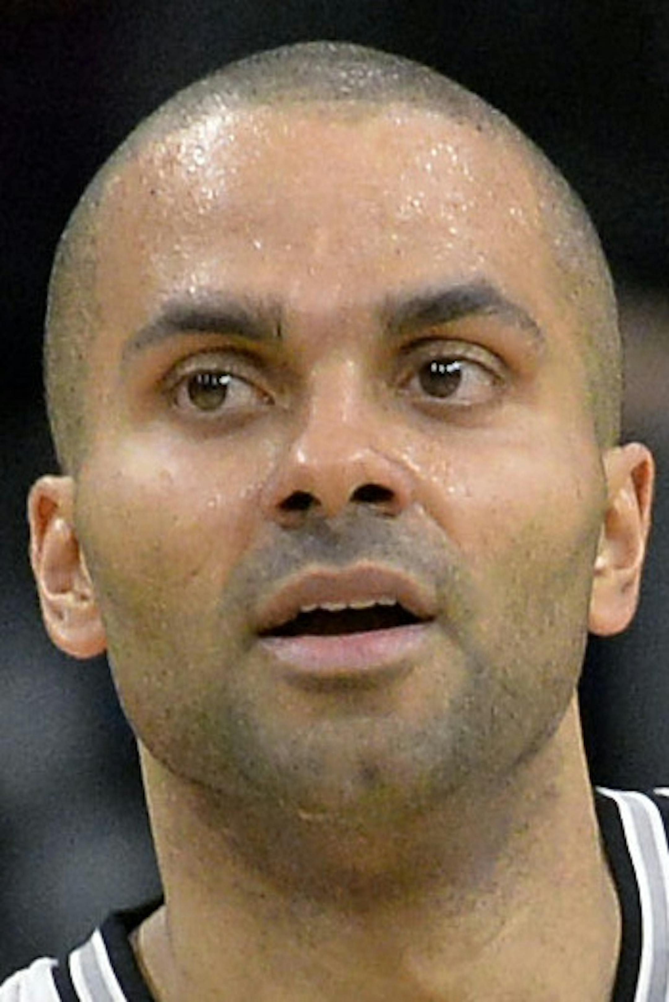San Antonio Spurs guard Tony Parker, of France, celebrates a basket during the second half of an NBA basketball game against the Indiana Pacers, Monday, Dec. 21, 2015, in San Antonio. San Antonio won 106-92. (AP Photo/Darren Abate)