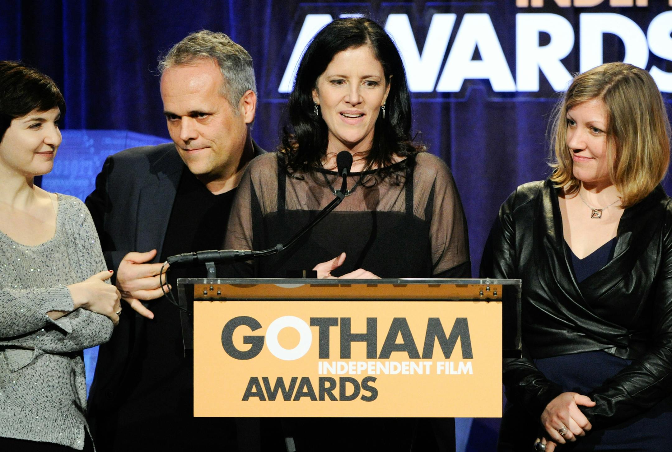 Director Laura Poitras, center, accepts the "Best Documentary" award for the film "CITIZENFOUR" at The Independent Film Project's 24th Annual Gotham Independent Film Awards at Cipriani Wall Street on Monday, Dec. 1, 2014, in New York. (Photo by Evan Agostini/Invision/AP)