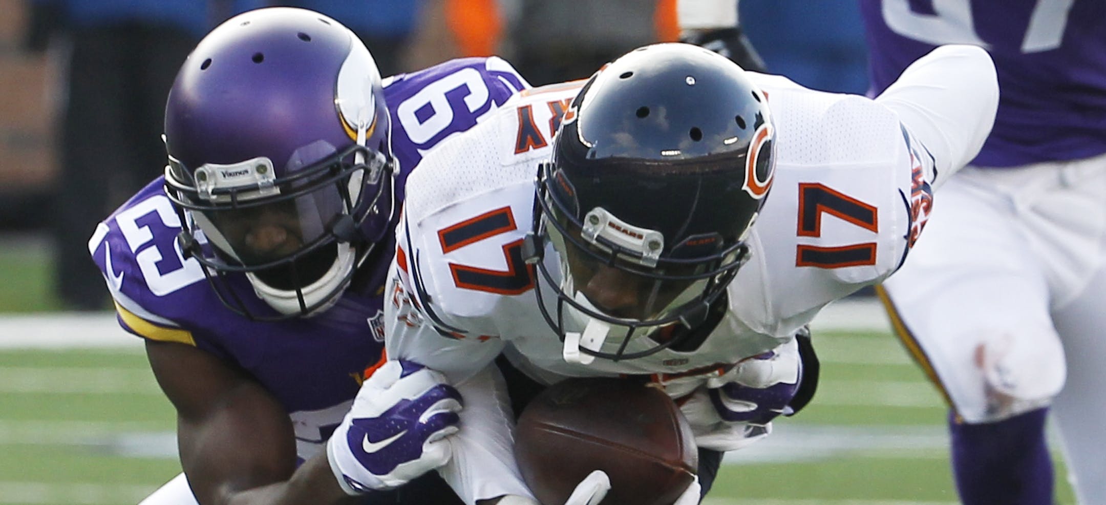 Chicago Bears wide receiver Alshon Jeffery, left, catches a pass in front of Minnesota Vikings cornerback Xavier Rhodes during the second half of an NFL football game, Sunday, Dec. 28, 2014, in Minneapolis. (AP Photo/Ann Heisenfelt) ORG XMIT: MNCN1