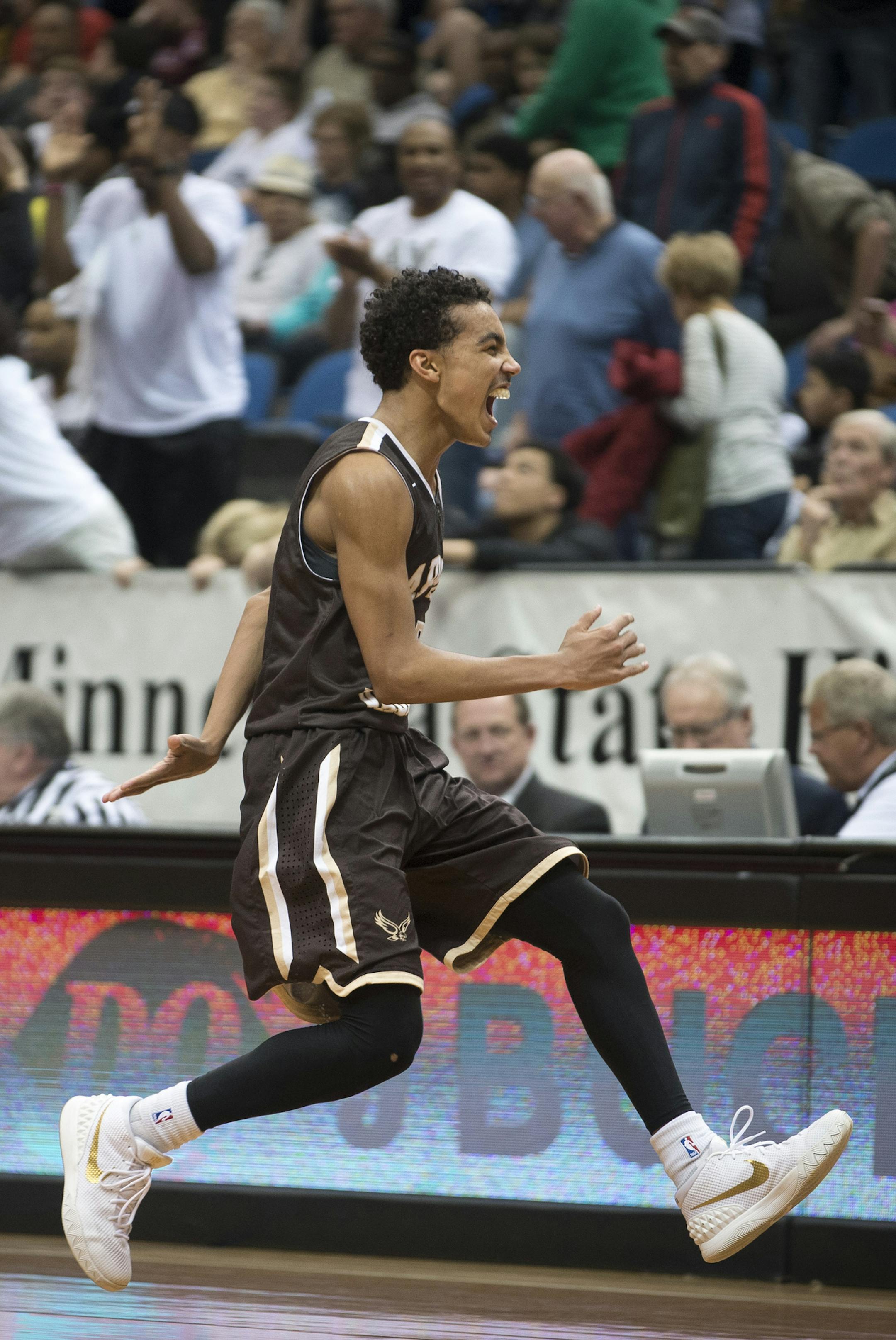 Apple Valley guard Tre Jones (3) rushes toward his brother, assistant coach Jadee Jones, to celebrate their victory over Champlin Park in the Class 4A boys' basketball championship. ] (Aaron Lavinsky | StarTribune) Champlin Park takes on Apple Valley in the Class 4A boys' basketball championship game on Saturday, March 14, 2014 at Target Center.
