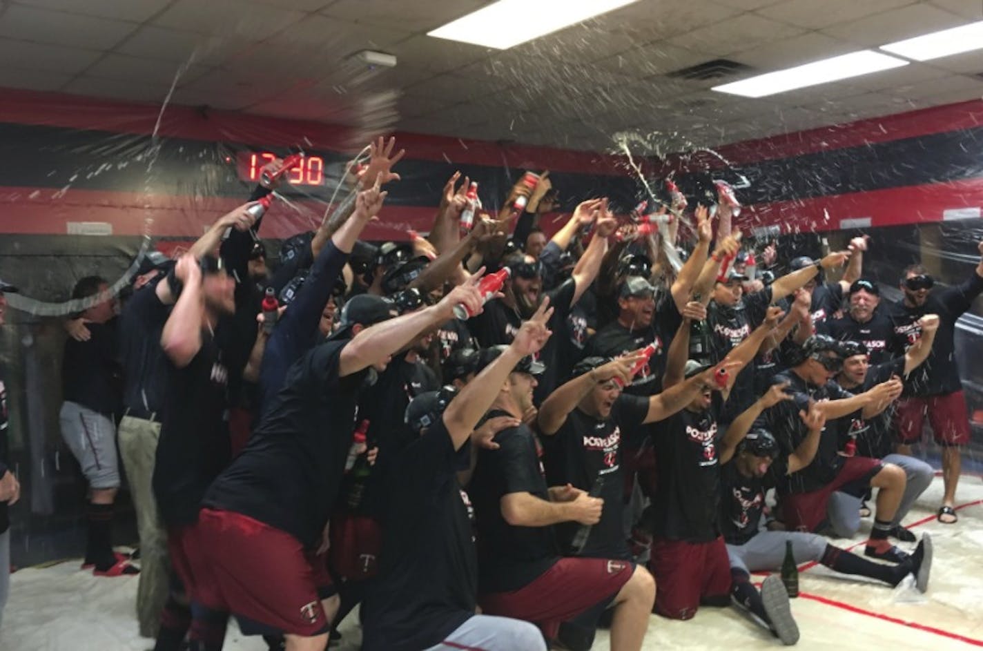 Twins players celebrated in the clubhouse after clinching a postseason berth late Wednesday night.