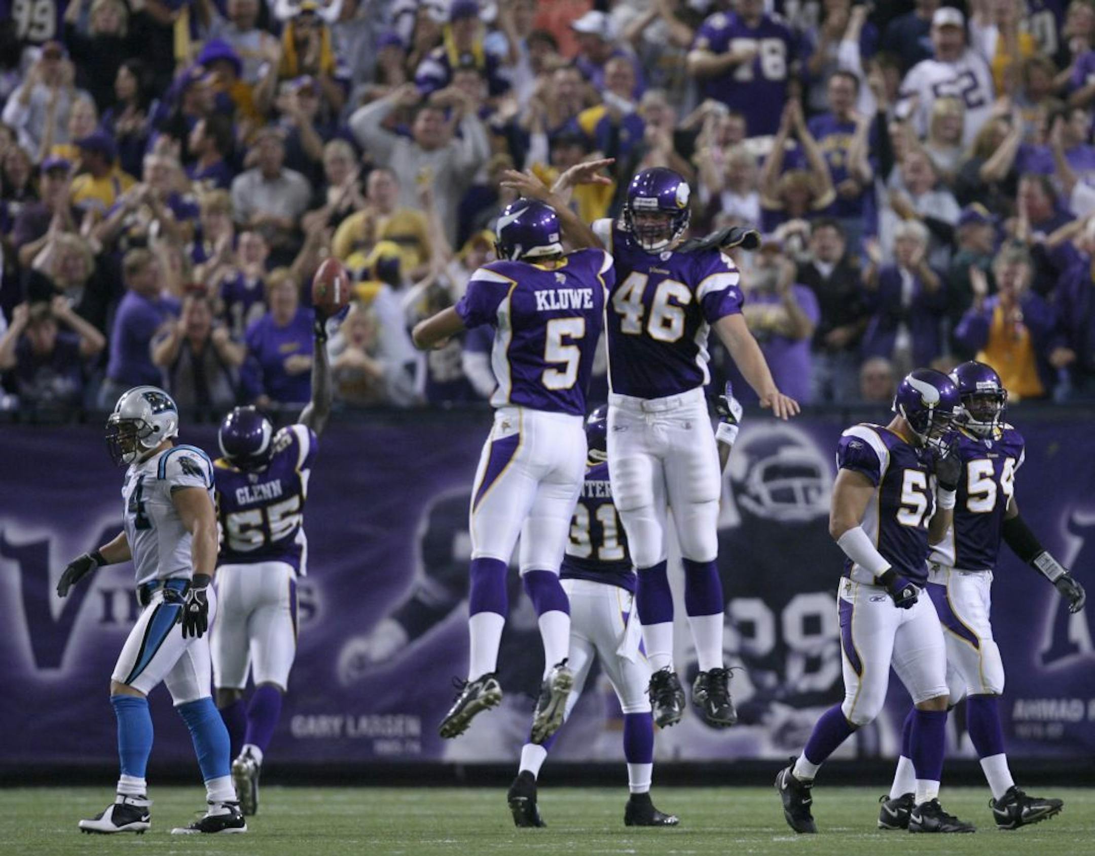 The Vikings' punter Chris Kluwe (5) and Cullen Loeffler (46) celebrated a Vikings recovery of a Carolina fumble of Kluwe's fourth quarter punt. Jason Glenn (55), rear, recovered the fumble. The Vikings scored their only touchdown on the resulting drive. GENERAL INFORMATION: JEFF WHEELER � jwheeler@startribune.com MINNEAPOLIS - 9/17/06 - The Vikings remained undefeated with a 16 - 13 overtime win over the Carolina Pathers in their home opener at the Metrodome in Minneapolis Sunday afternoon.