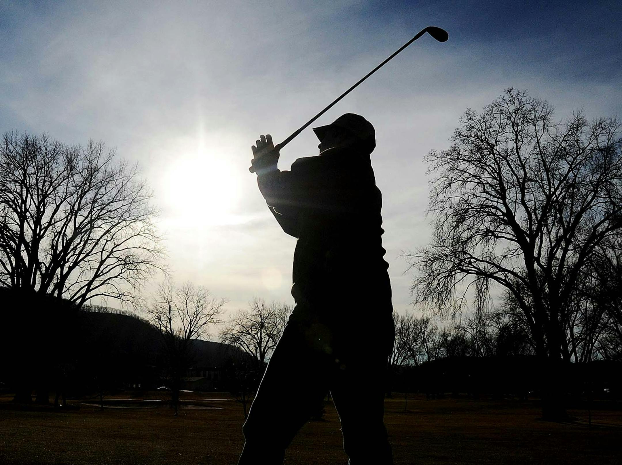 Golfers took to the nine-hole course at Westfield Golf Club in Winona, Minn. on Thursday, Jan. 5, 2012, as temperatures reached 50 degrees in the afternoon. (AP Photo/Winona Daily News, Andrew Link) MANDATORY CREDIT ORG XMIT: MIN2013040313315759