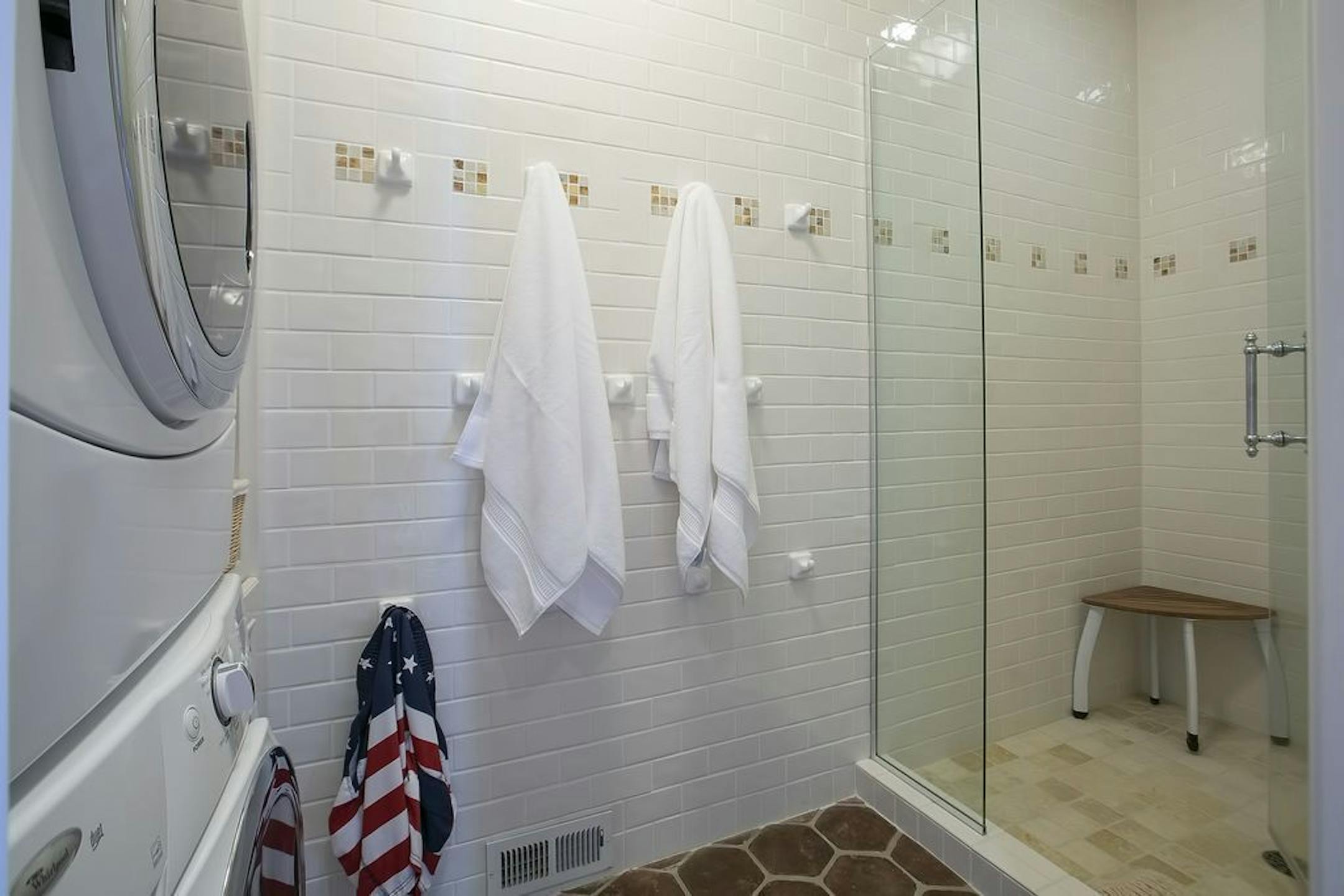 The changing room for the pool includes a shower and laundry.