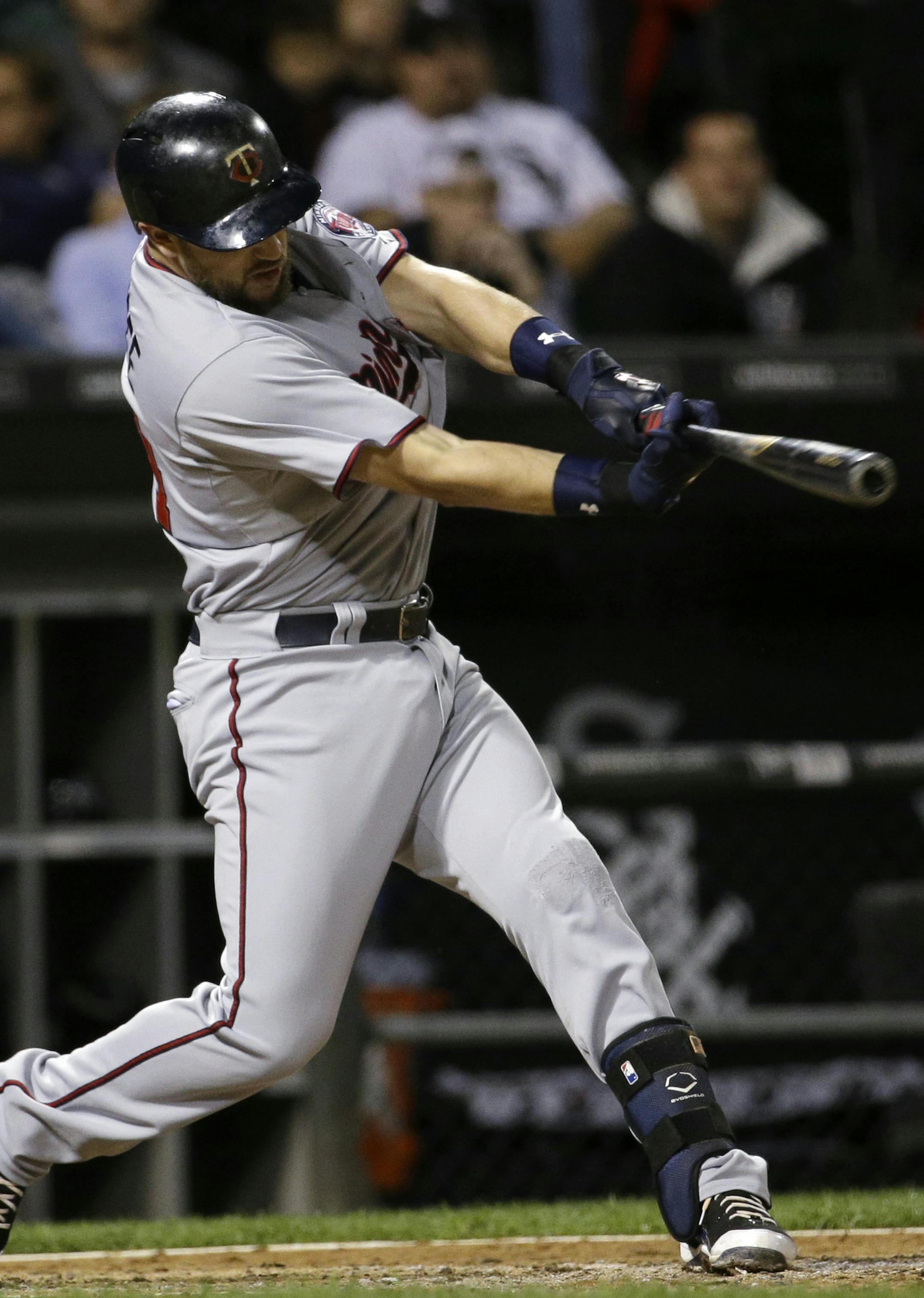 Minnesota Twins' Trevor Plouffe hits an one-run single against the Chicago White Sox during the eighth inning of a baseball game, Friday, Sept. 11, 2015, in Chicago. The Twins won 6-2. (AP Photo/Nam Y. Huh)