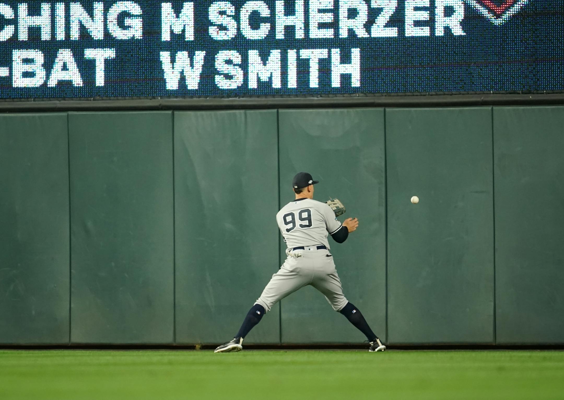 New York Yankees right fielder Aaron Judge (99) played ball off the way that wash it by Minnesota Twins right fielder Eddie Rosario (20) in the second inning.