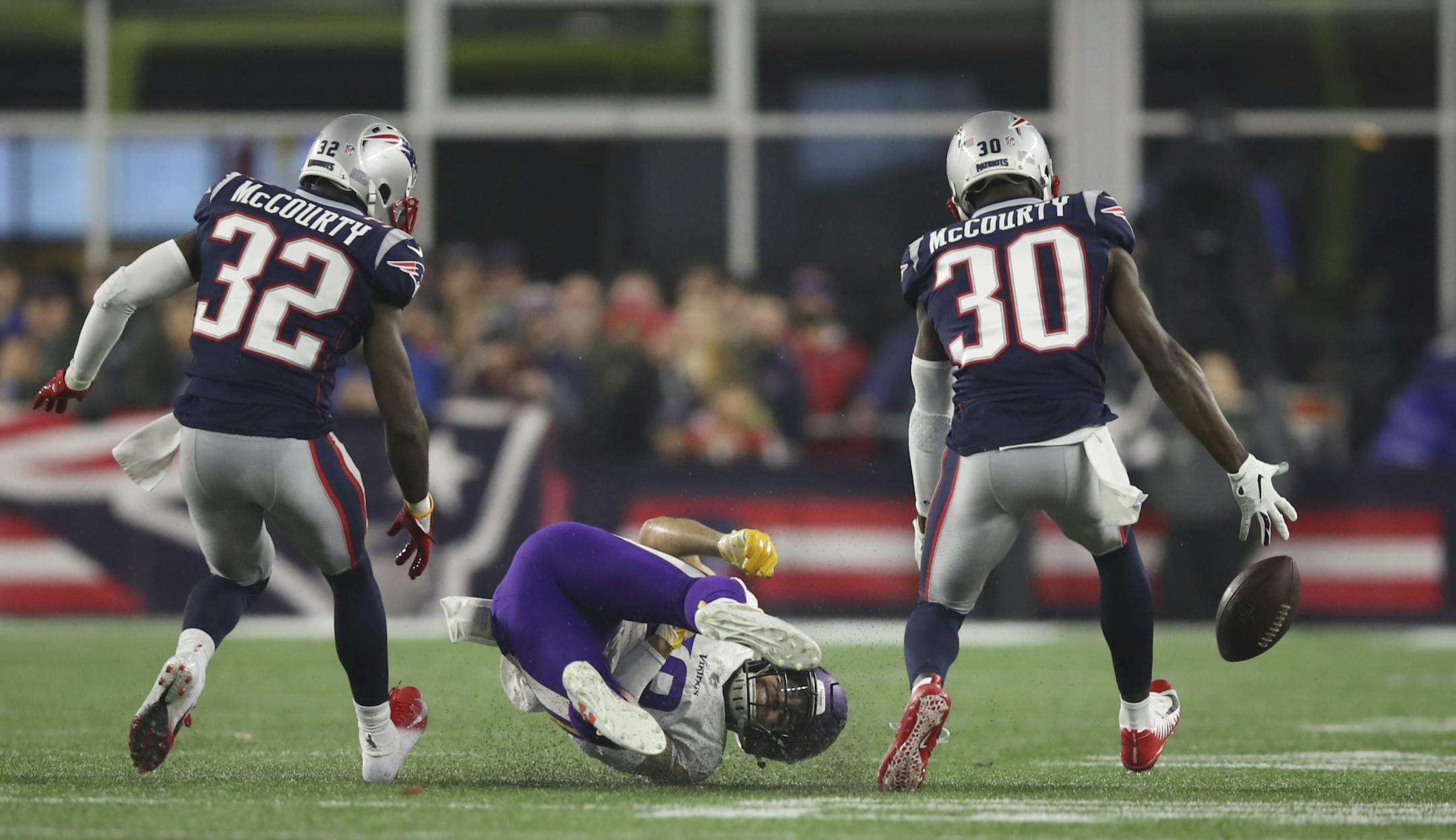 Minnesota Vikings wide receiver Adam Thielen (19) couldn't reach a third quarter pass while double covered by twins free safety Devin McCourty (32) and cornerback Jason McCourty (30).