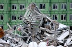 A pile of rubbish from the old State Farm headquarters was piled near a new hotel that is being built, Tuesday, January 26, 2016 in Woodbury, MN. ] (E